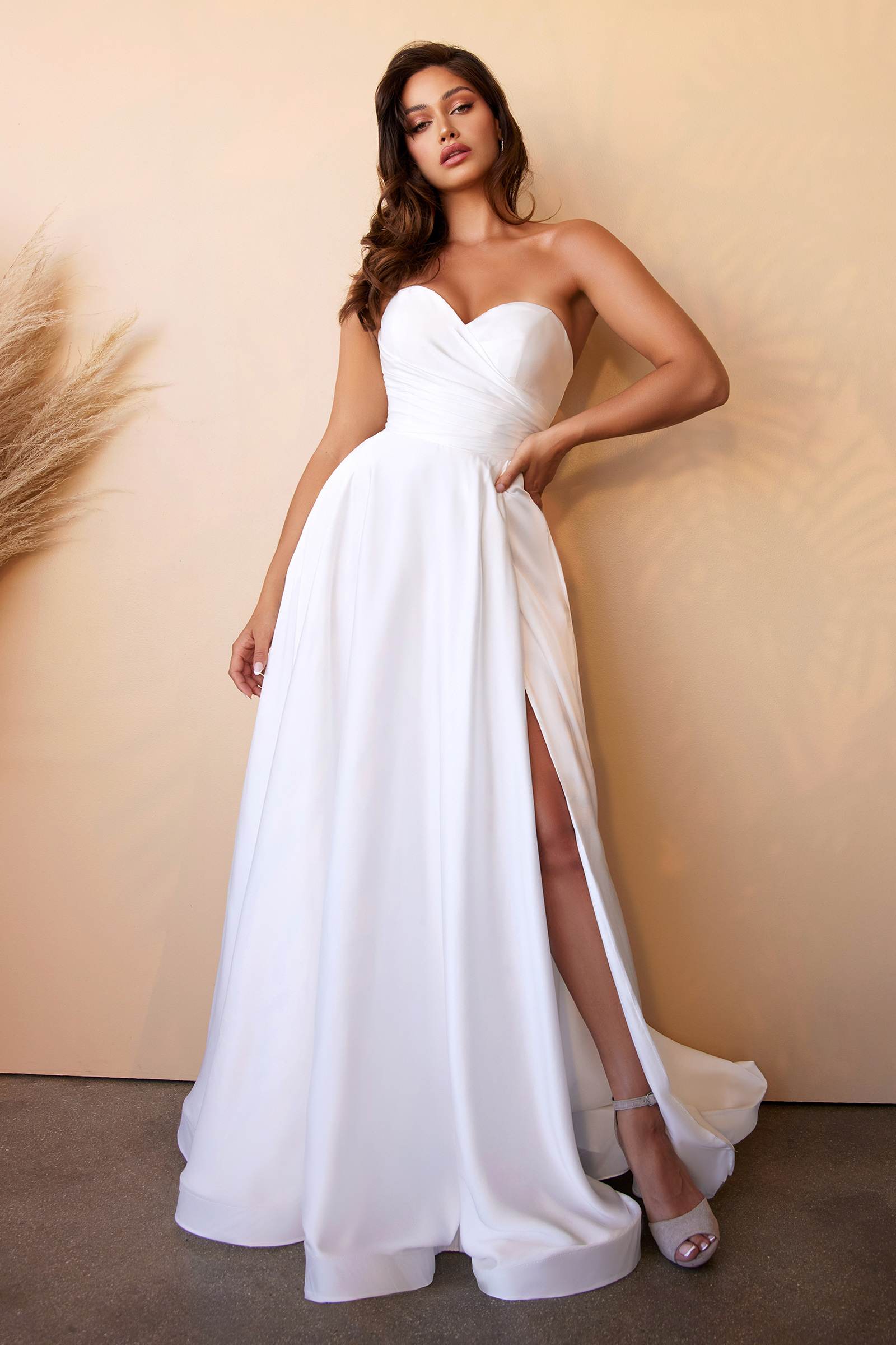 Off-white satin strapless sweetheart ball gown with gathered waist and front slit