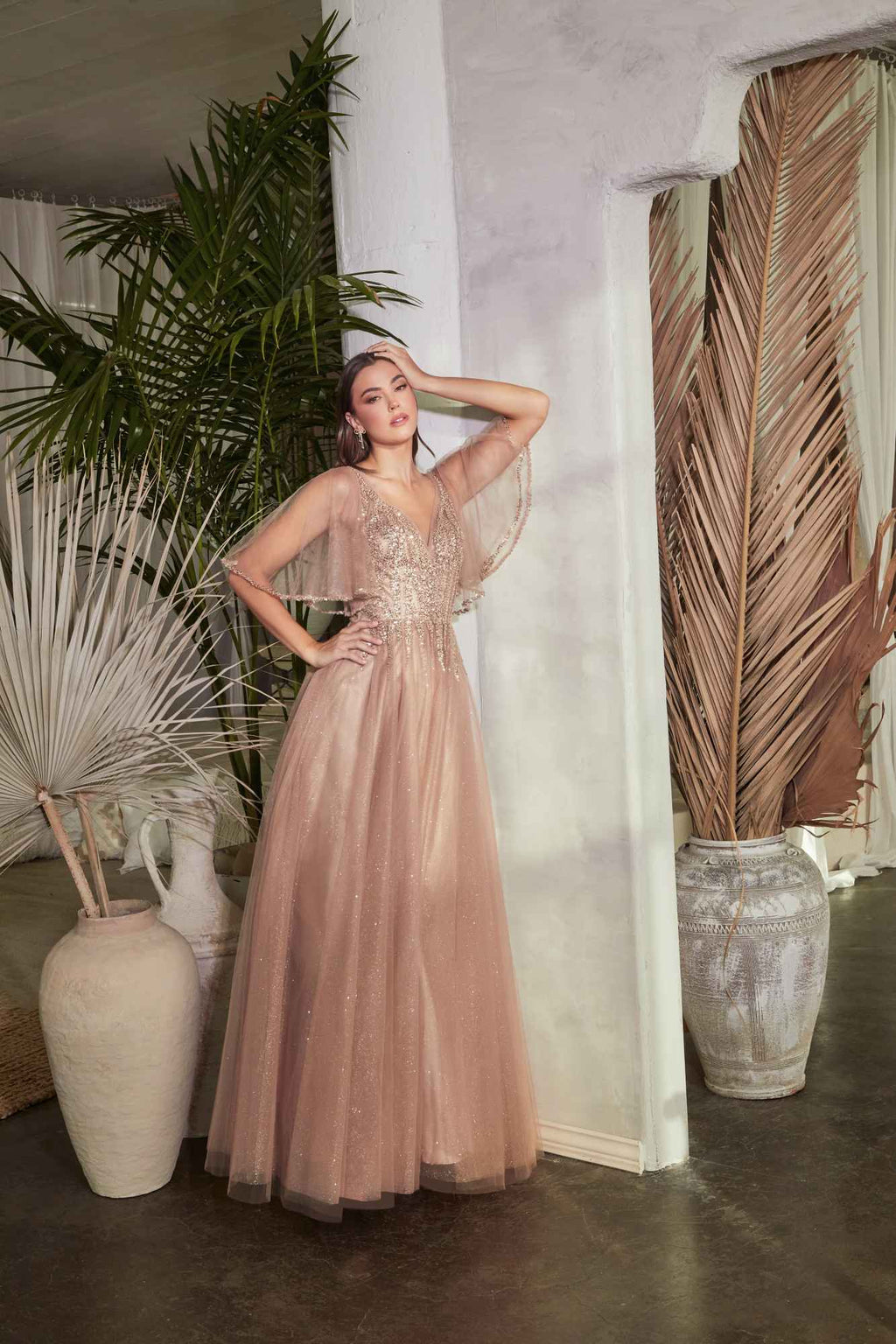 Rose gold tulle A-line gown with embellished bodice and flowing layered skirt.