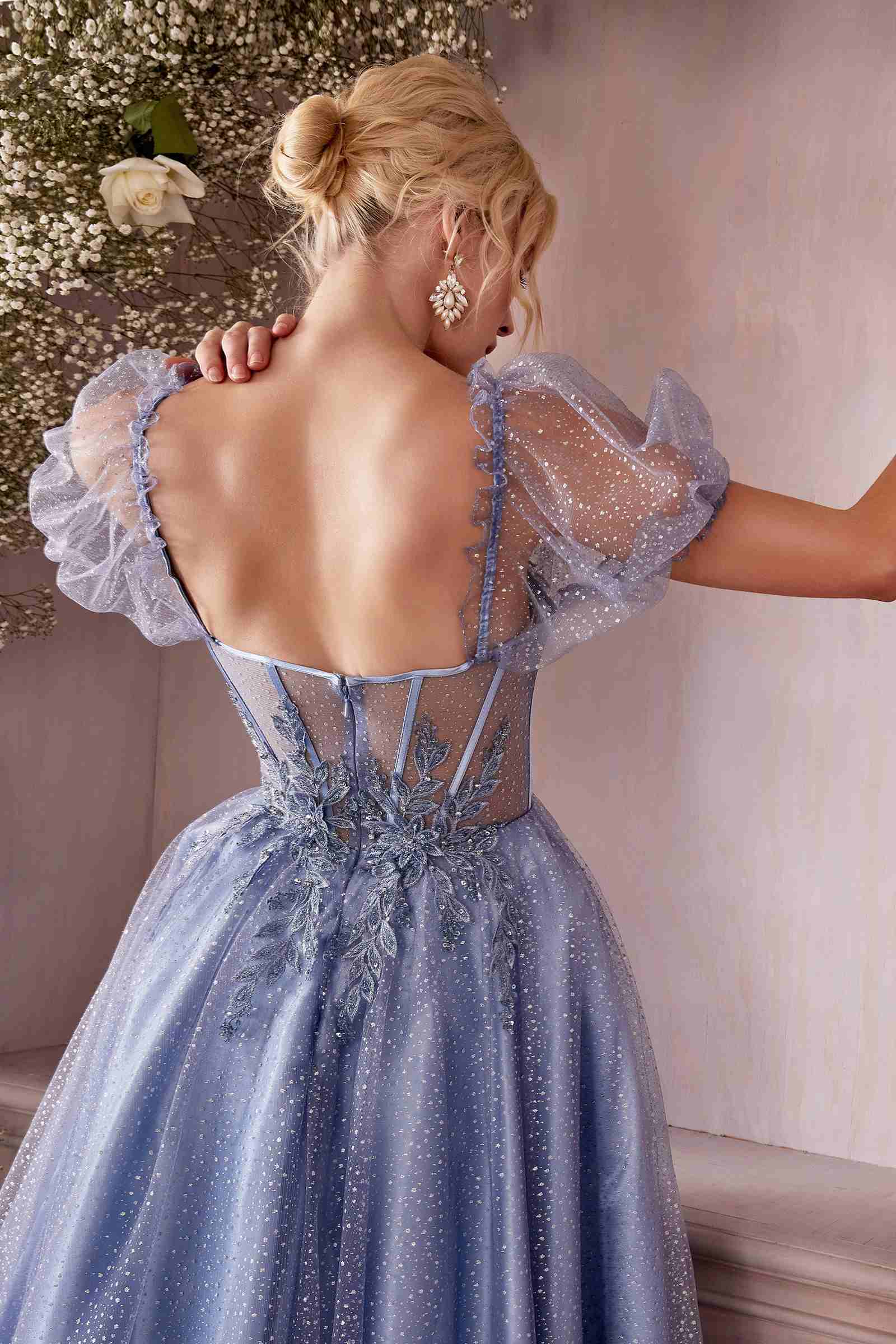 Blue tea-length layered tulle dress with open-back lace detailing and puff sleeves
