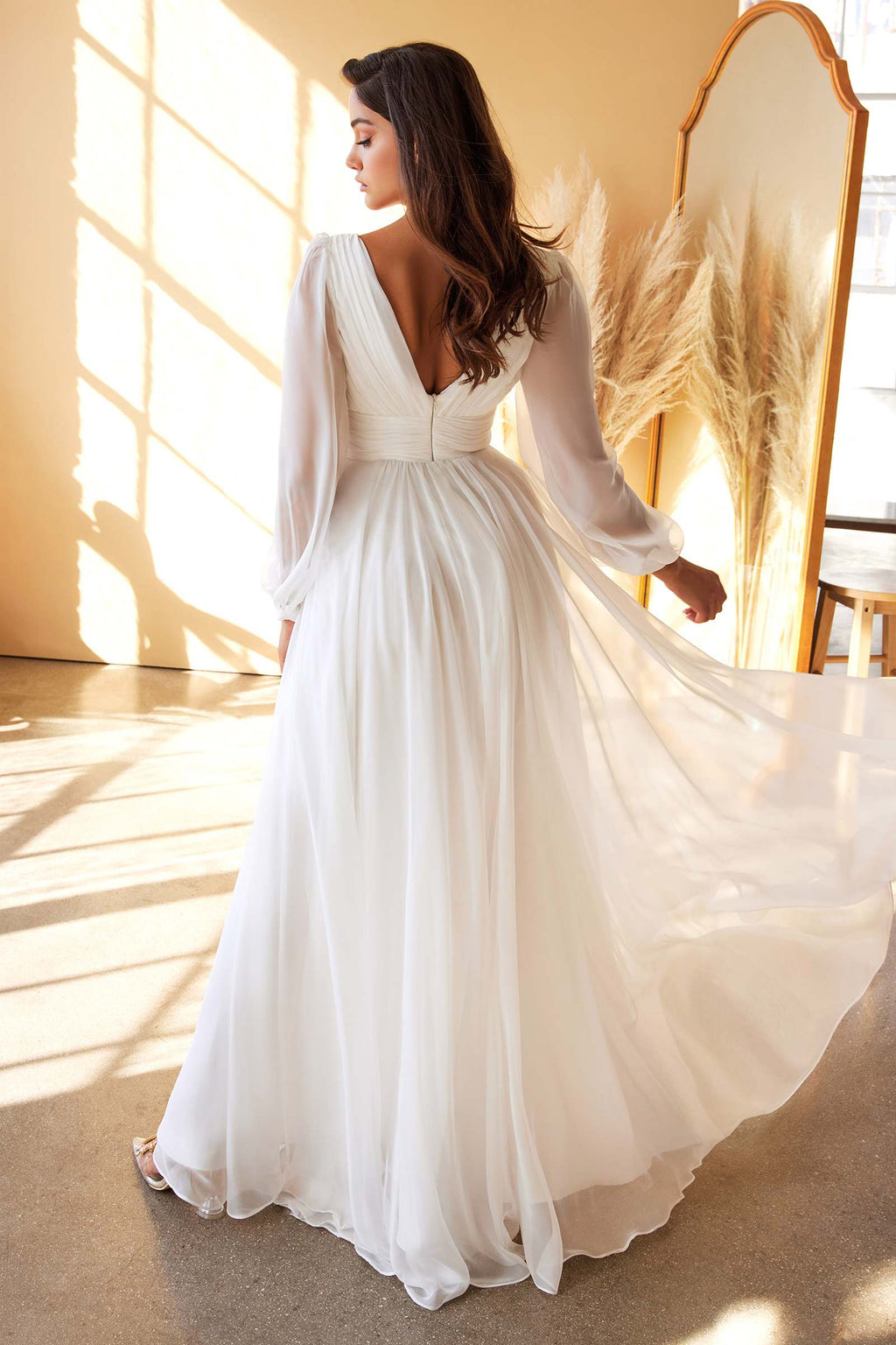 Off-white A-line chiffon dress with long sleeves, V-neck, and flowing skirt