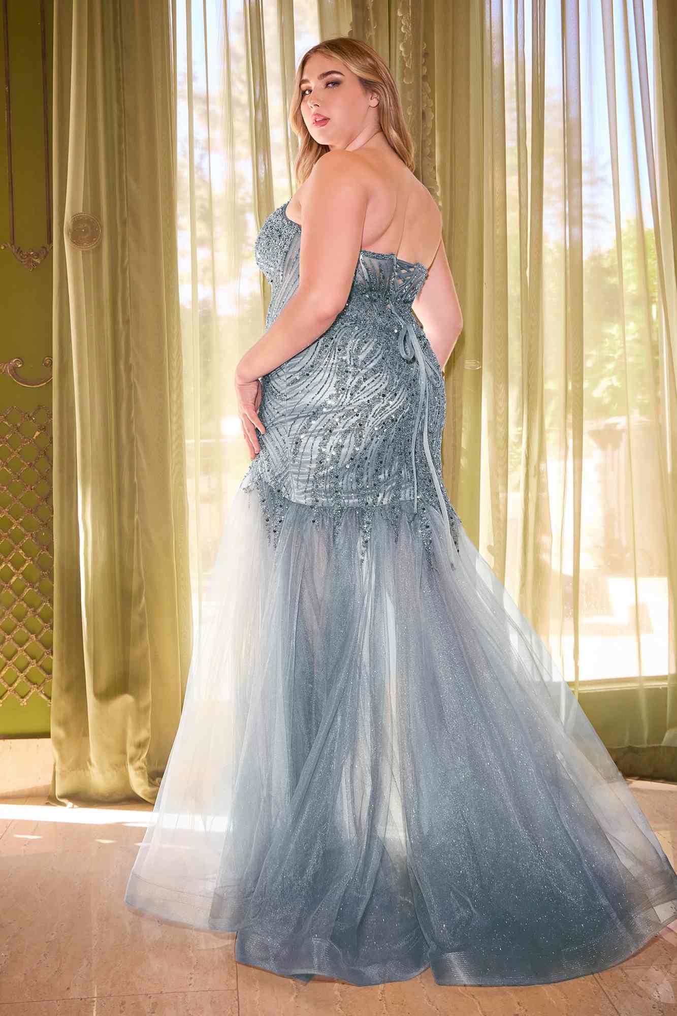 Dusty blue strapless mermaid dress with beaded bodice and layered tulle train, slit