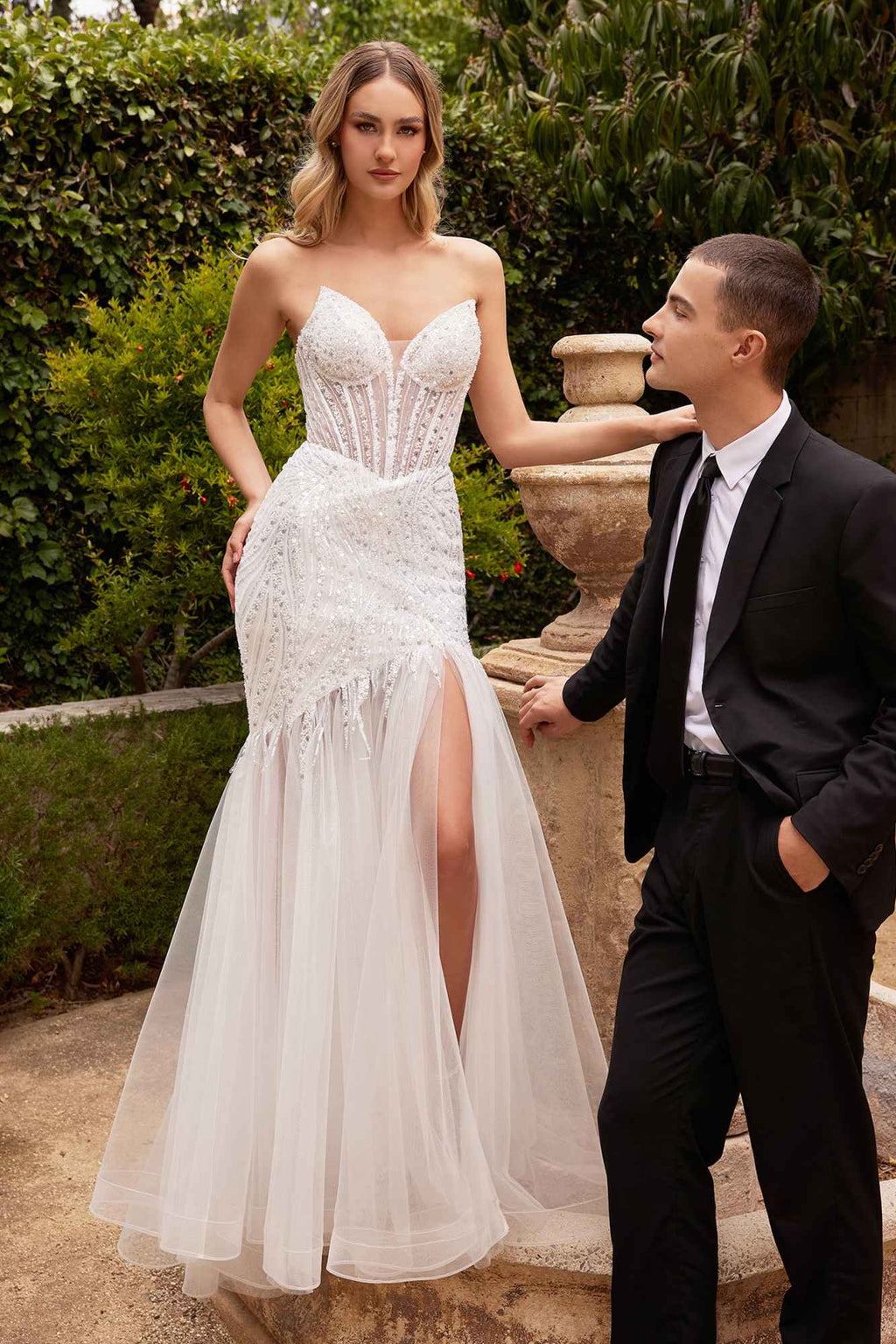 Off-white strapless beaded mermaid gown with pointed bust and long tulle skirt