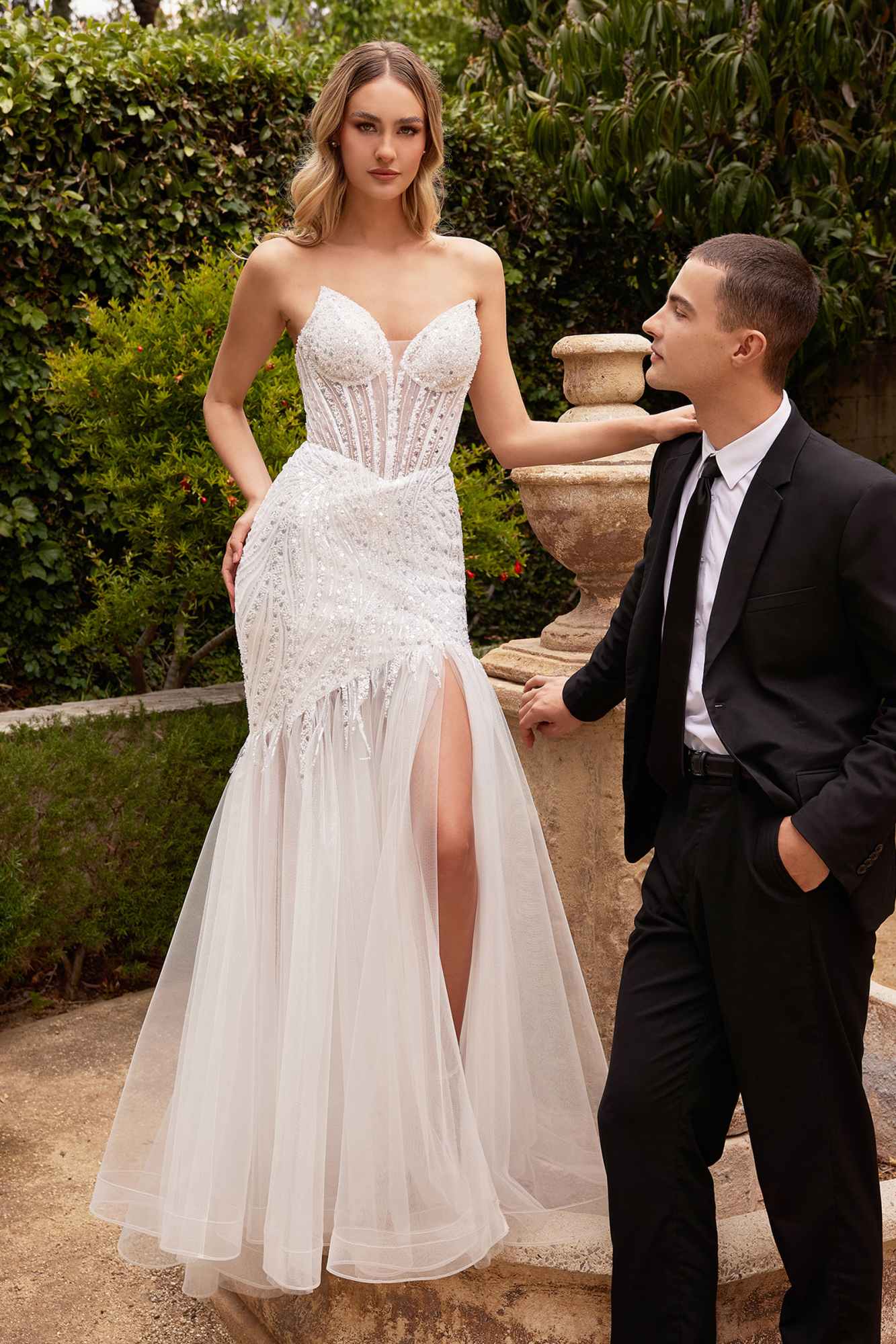 Off-white strapless beaded mermaid gown with pointed bust and long tulle skirt