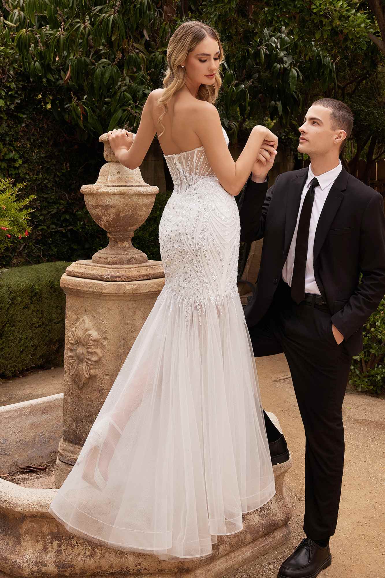 Off-white strapless beaded mermaid gown with pointed bust and flowing tulle skirt