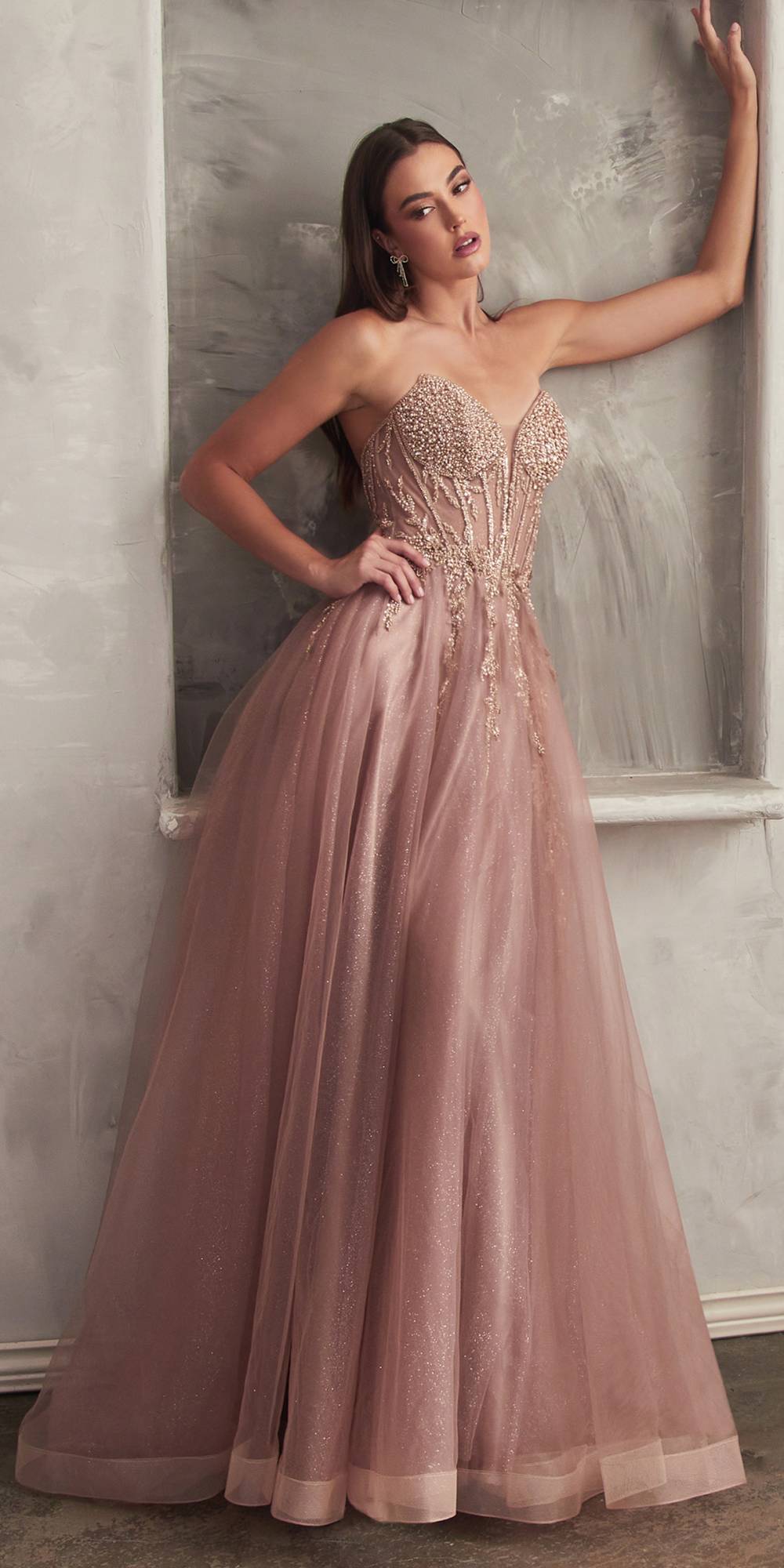 Layered strapless tulle bridal gown with fitted bodice and long light pink skirt