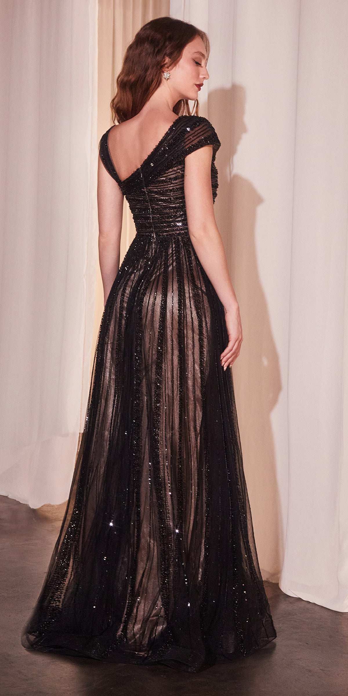 Beaded off-shoulder A-line gown, black with open back and sparkling beaded skirt