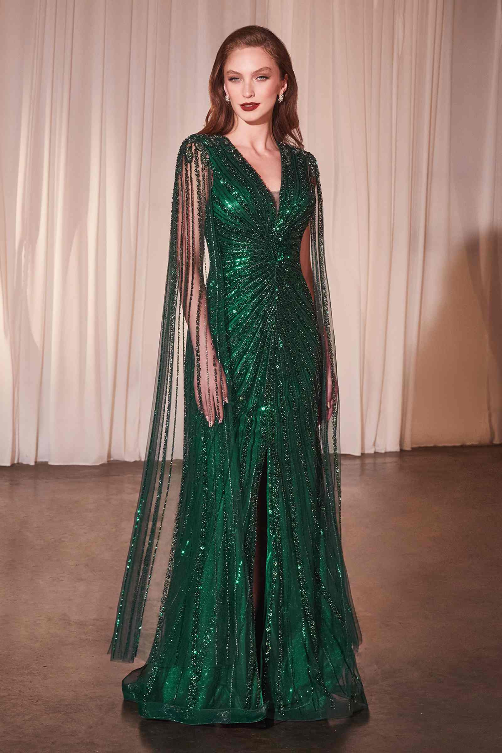 Emerald green beaded long-sleeve sheath gown with V-neck and fringe sequin cape