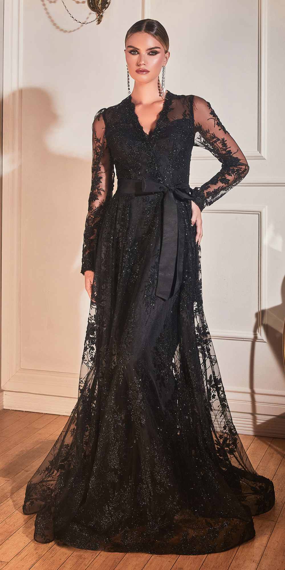 Black long-sleeve embellished ball gown with V-neck, lace sleeves, and wide skirt