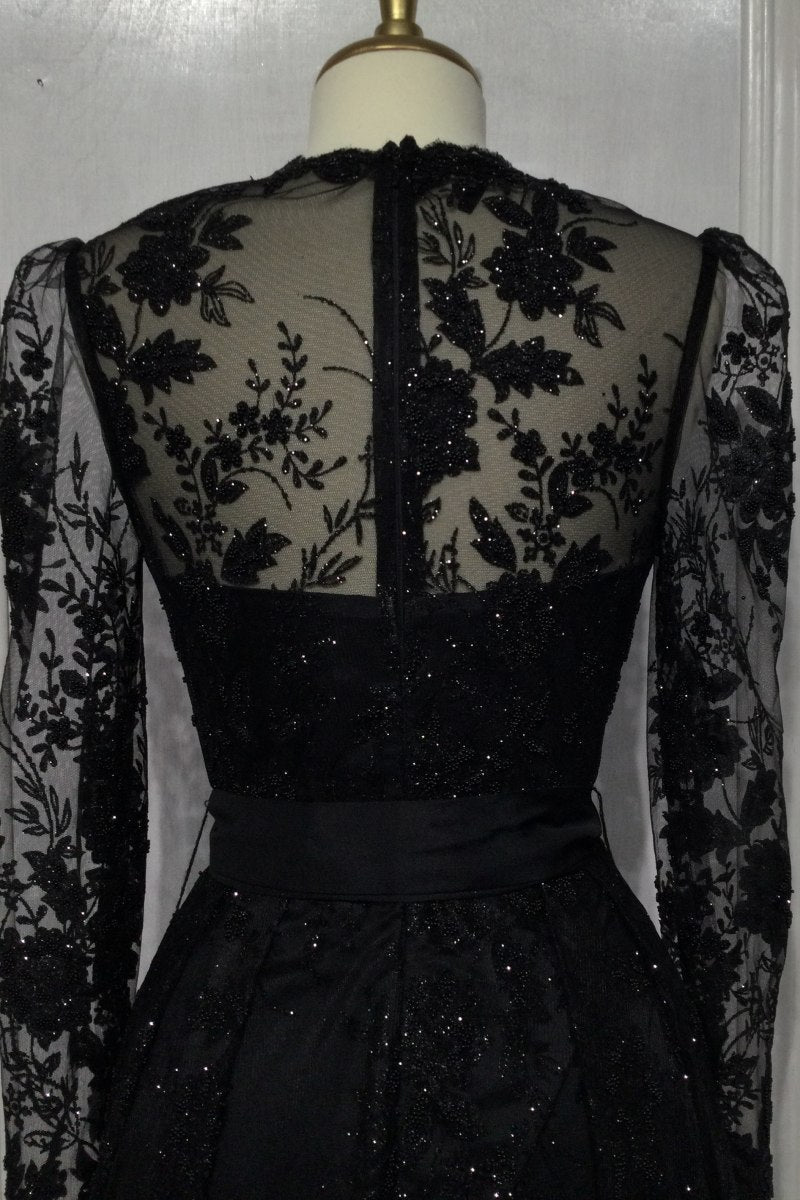 Black lace long-sleeve ball gown with embellished bodice and sheer back panels
