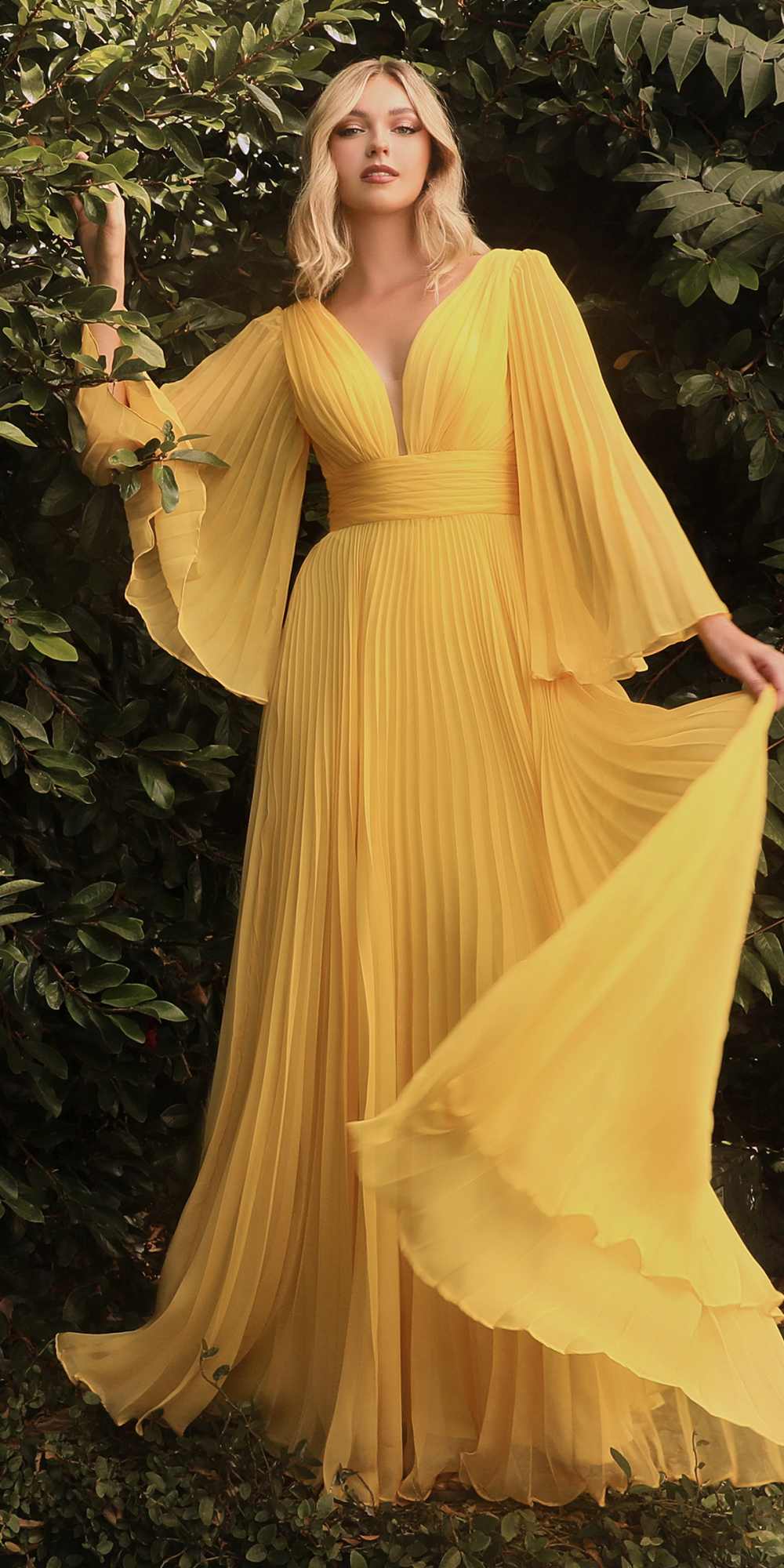 Mustard yellow pleated chiffon long-sleeve gown with V-neck and flutter sleeves