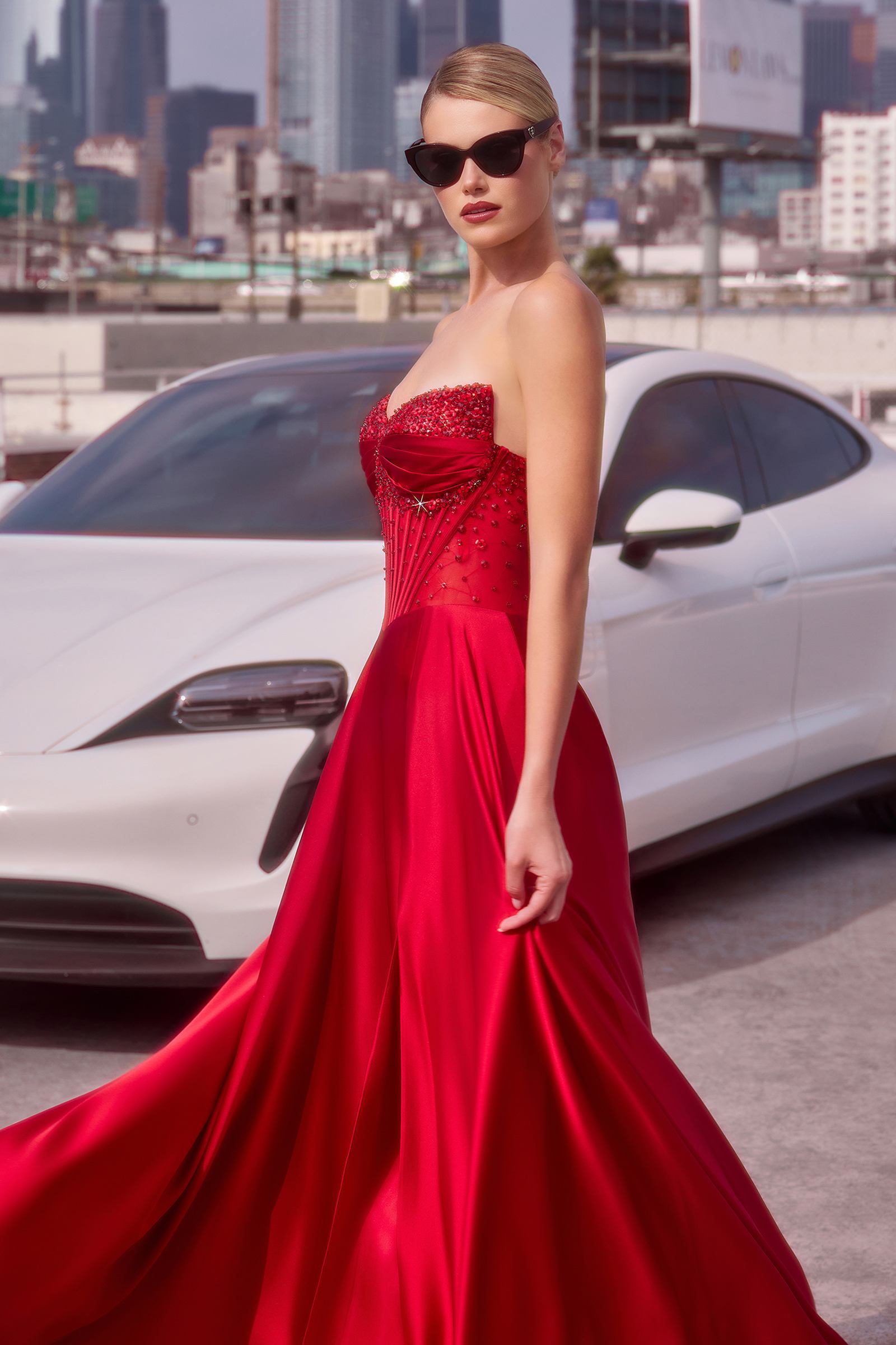 Beaded satin A-line prom dress, strapless sweetheart bodice, red with textured detailing.