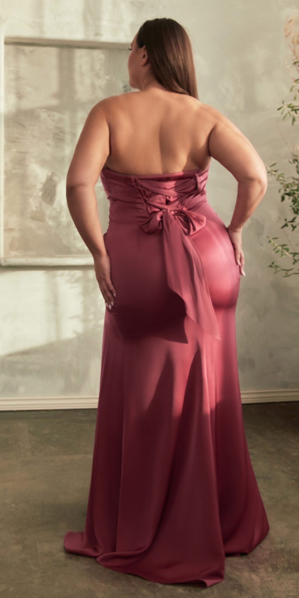 Red strapless long satin dress with draped back and front thigh-high slit