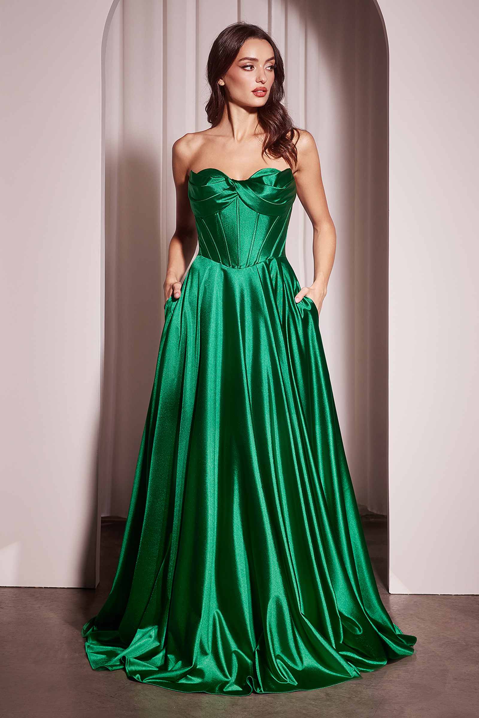 Green strapless satin A-line gown with sweetheart neckline and flowing pleated skirt