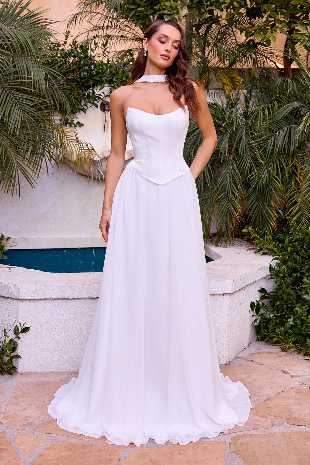 Off-white strapless A-line bridal gown with layered, flowing skirt