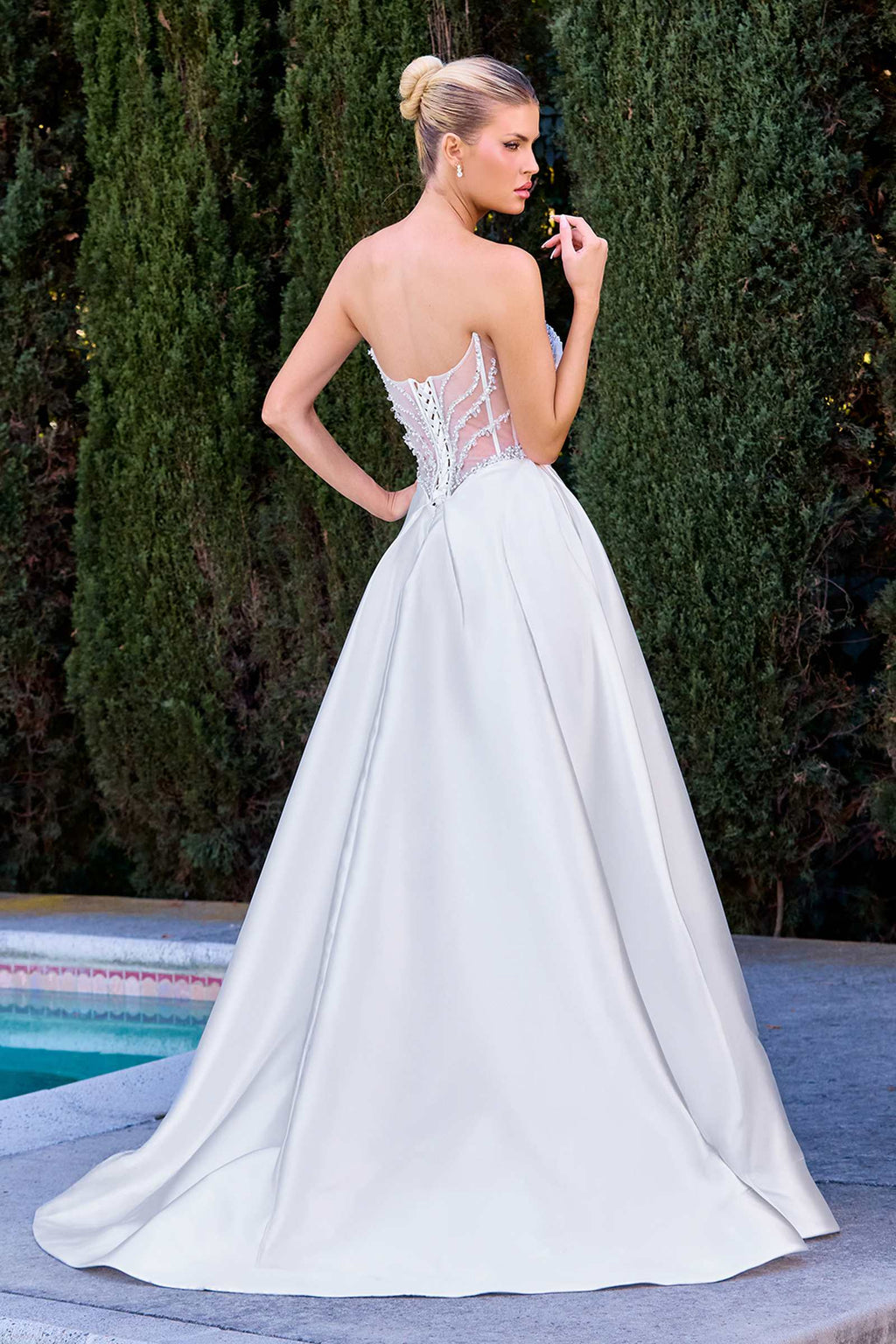 Off white A-line bridal gown, lace corset back with thin straps and flared skirt