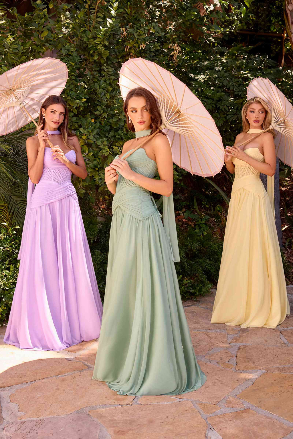 Strapless A-line flowy dresses in lavender, sage green, and pale yellow with ruched bodices