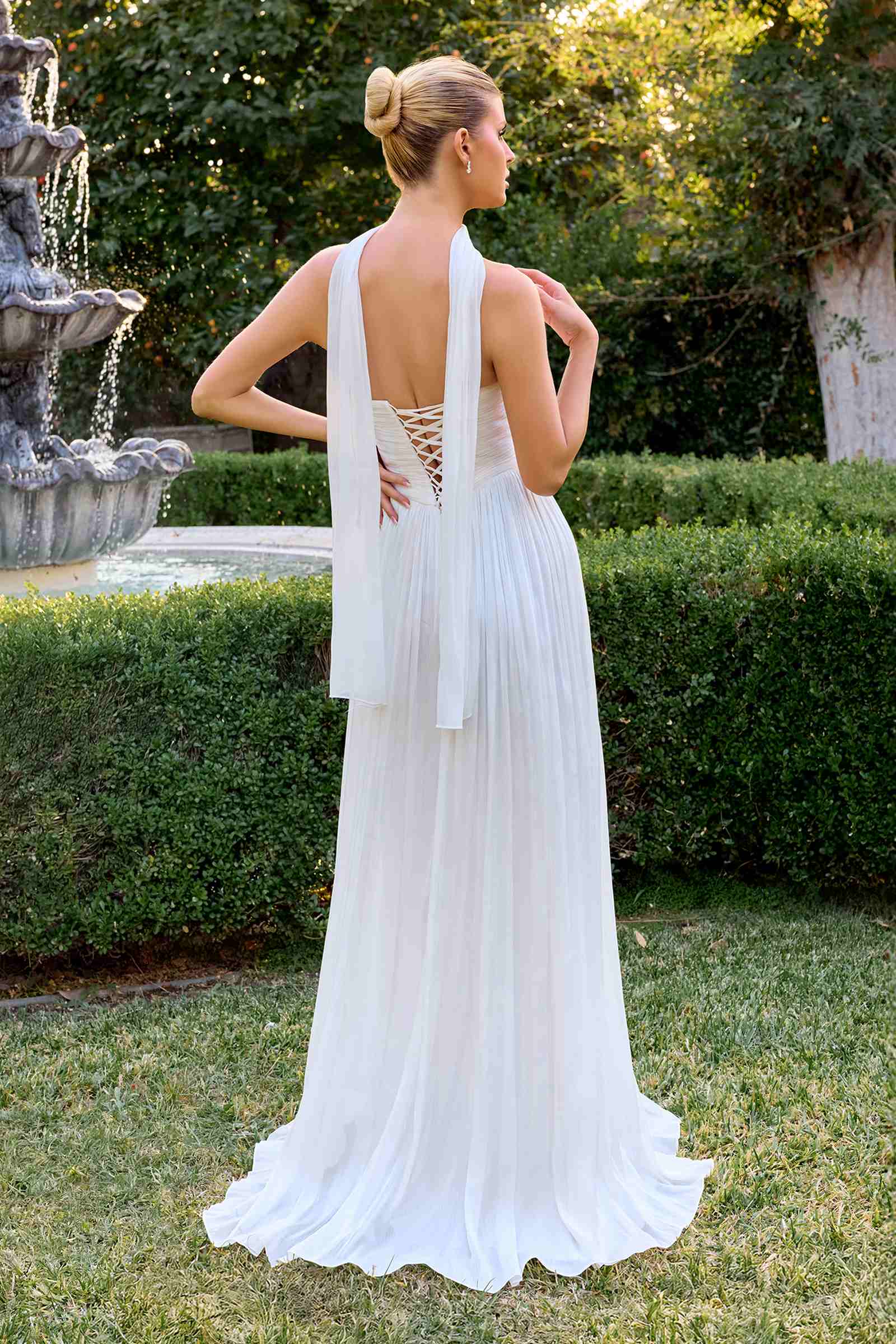 Off-white backless pleated chiffon A-line dress with halter straps and layered skirt