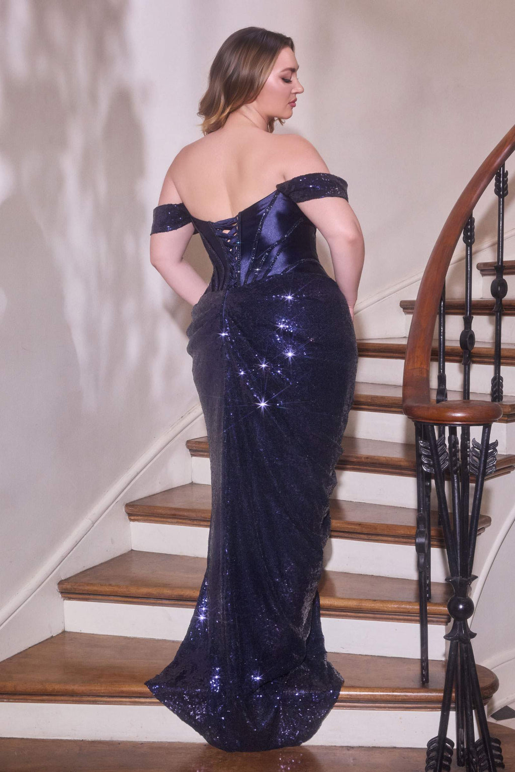 Navy off-shoulder corset dress, back view with corset seams and side slit