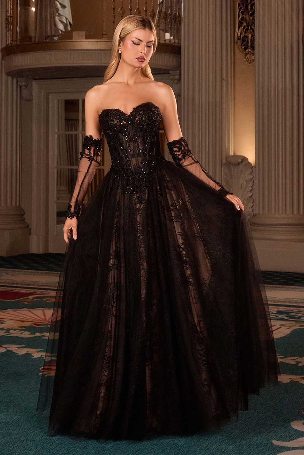 Black strapless A-line gown with textured lace bodice and flowing full skirt, lace gloves