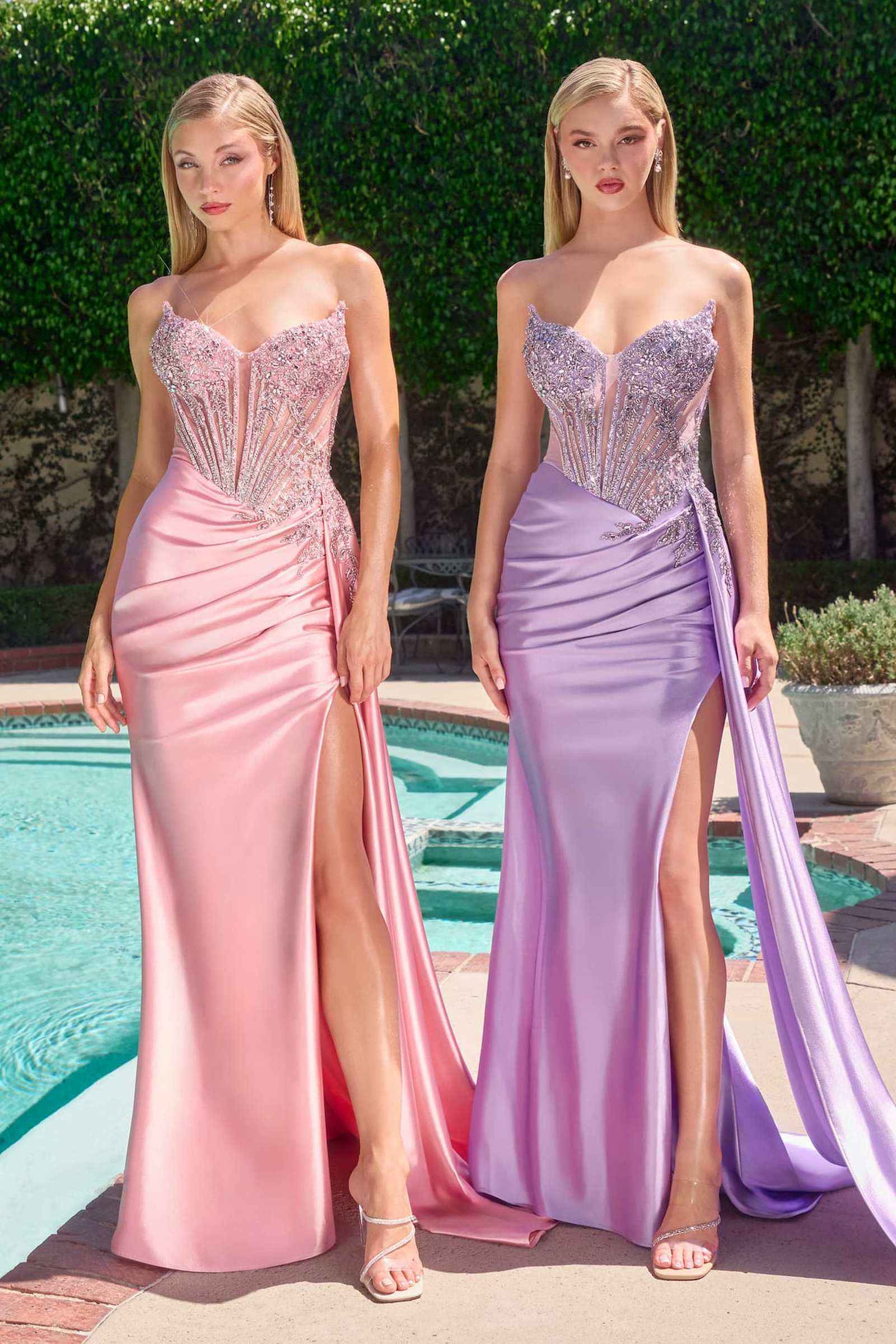 Strapless satin evening gowns on two models, pink and lavender with jeweled bodice