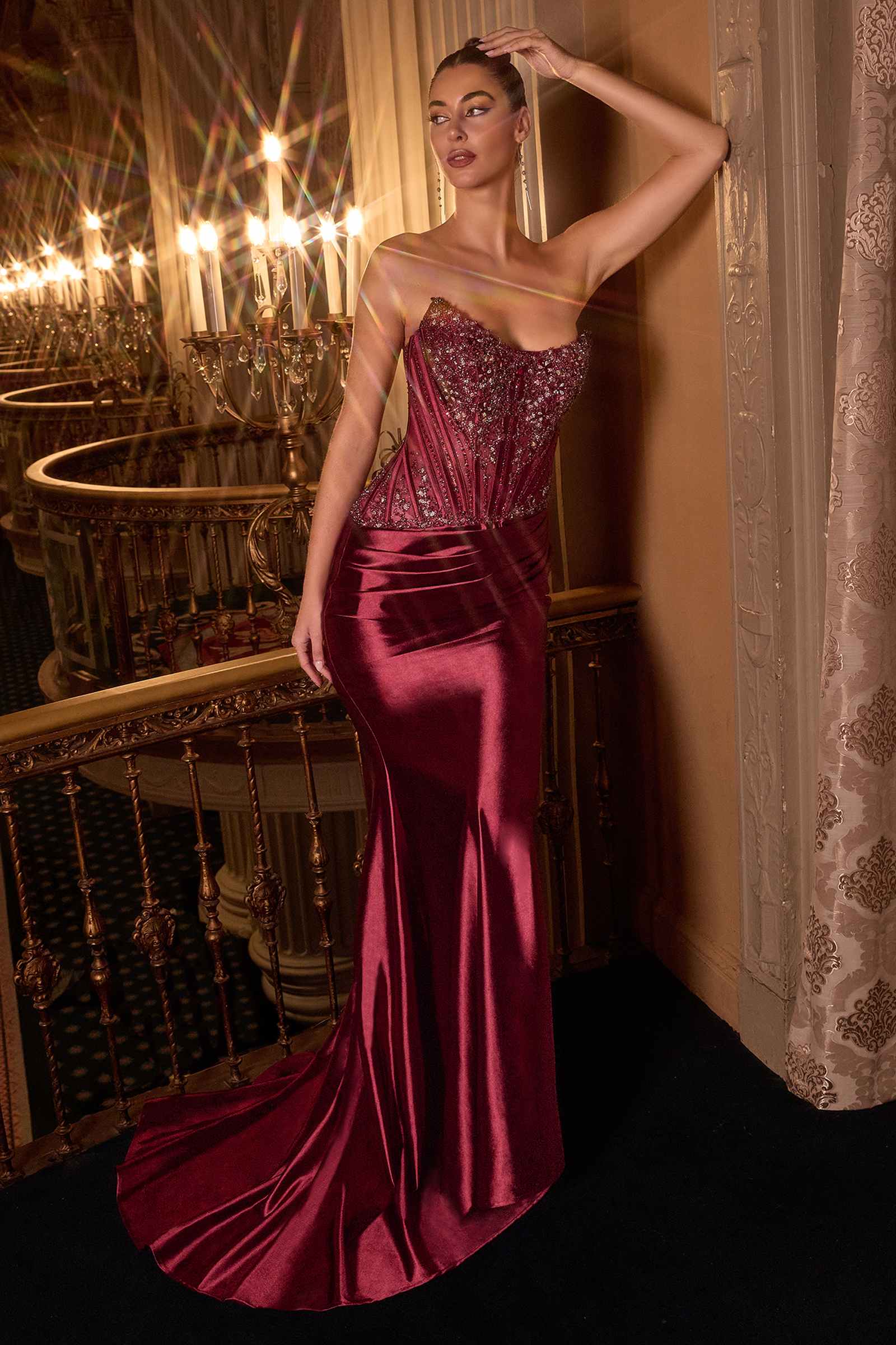 Strapless gown with crystal bodice and burgundy satin skirt, side profile