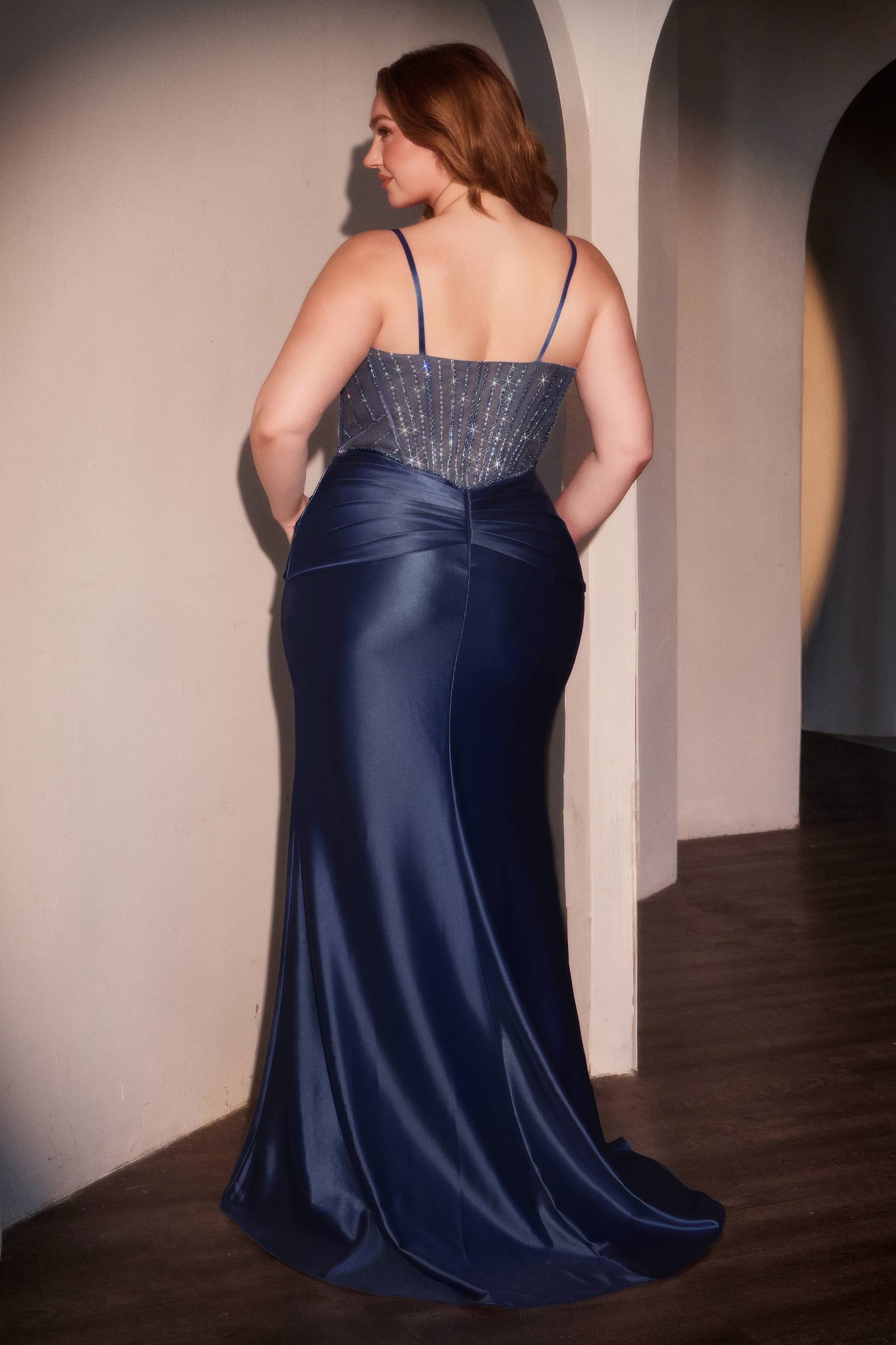 Dark blue satin mermaid gown with beaded backless straps and flared hem