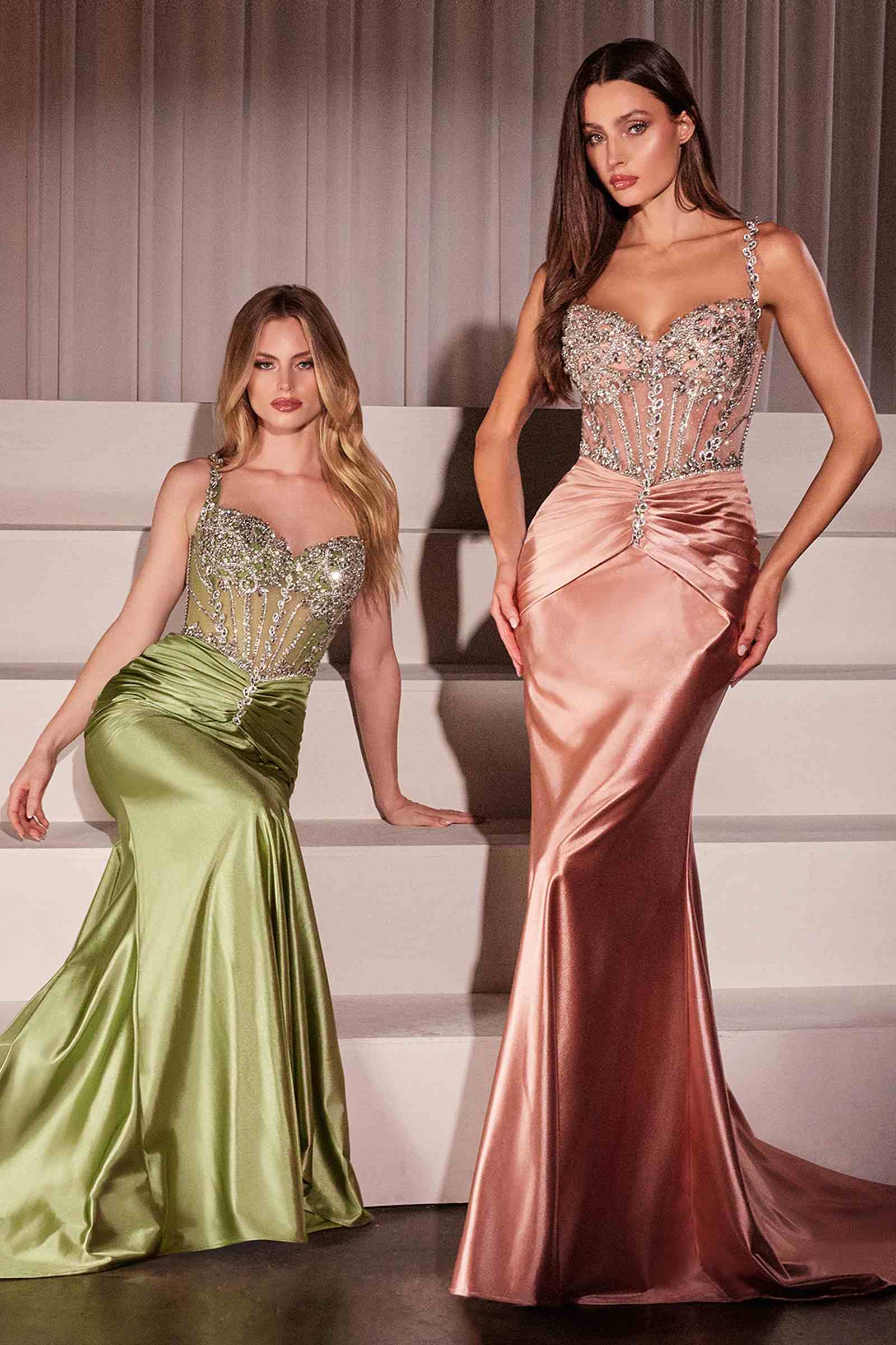 Two fitted satin gowns: green and rose gold with crystal-embellished bodices and ruched waists