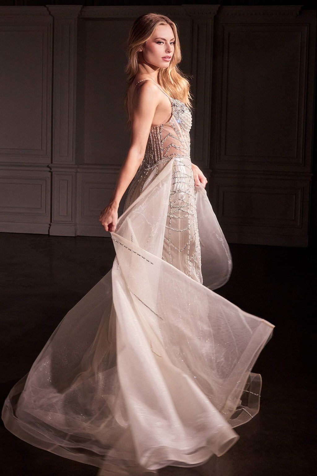 Platinum crystal-embellished gown with sheer flared overskirt, side view