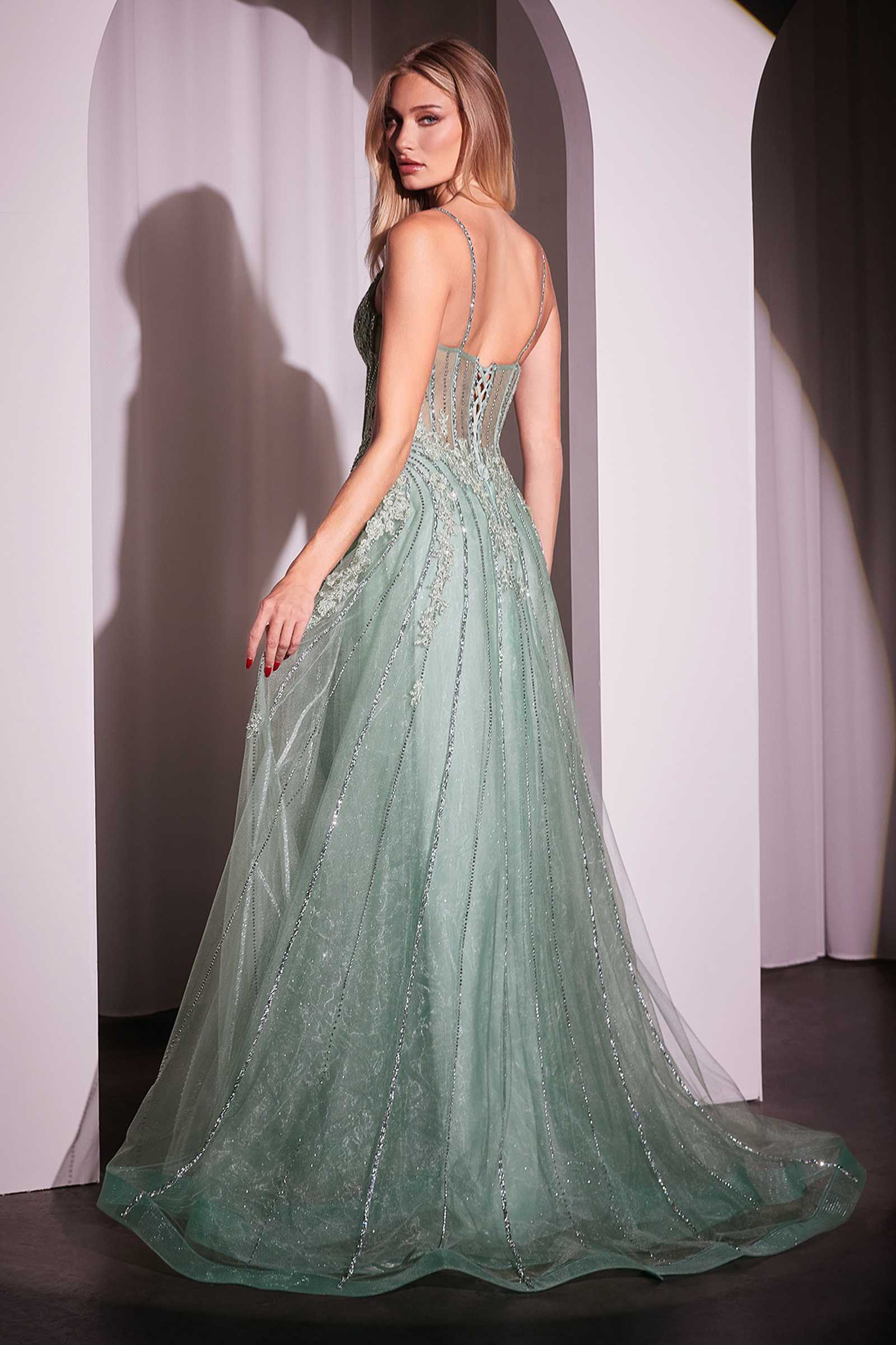 Sage green crystal-embellished A-line tulle gown with sheer flared skirt and spaghetti straps