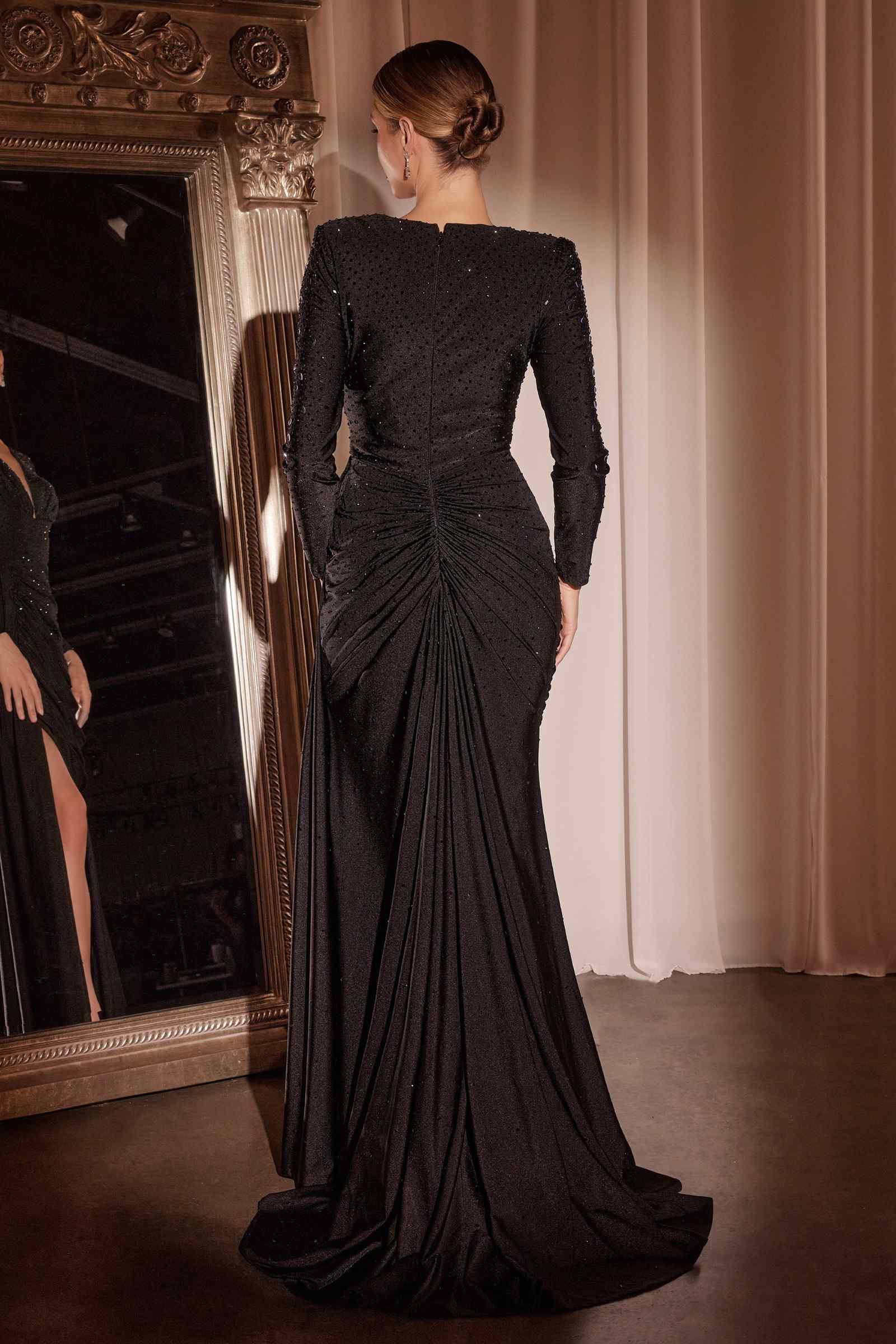 Black long-sleeve satin gown with ruched back and draped floor-length skirt