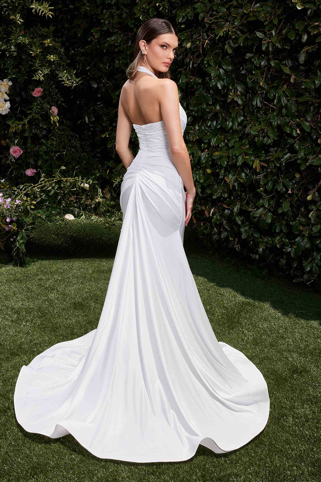 Off-white halter bridal dress with draped ruching and flowing flared skirt