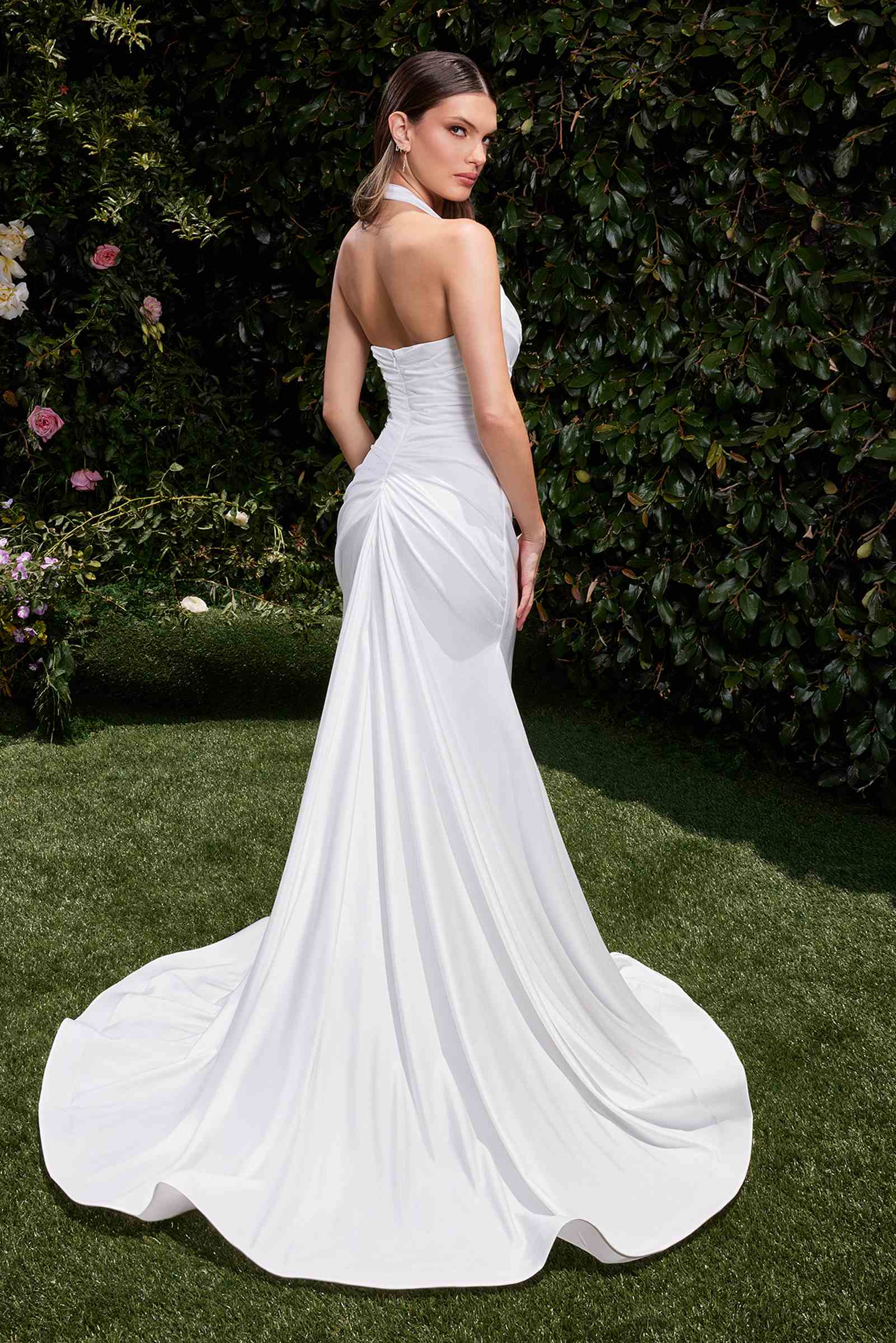 Off-white halter bridal dress with draped ruching and flowing flared skirt
