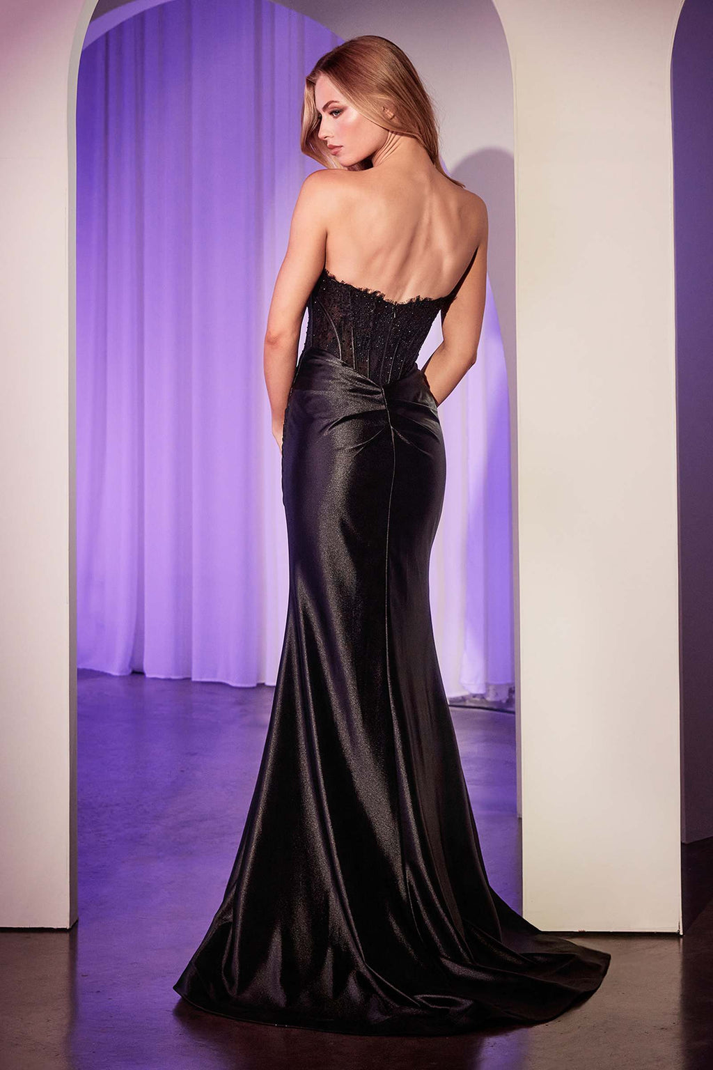 Black satin strapless gown with lace bodice detail and draped mermaid skirt