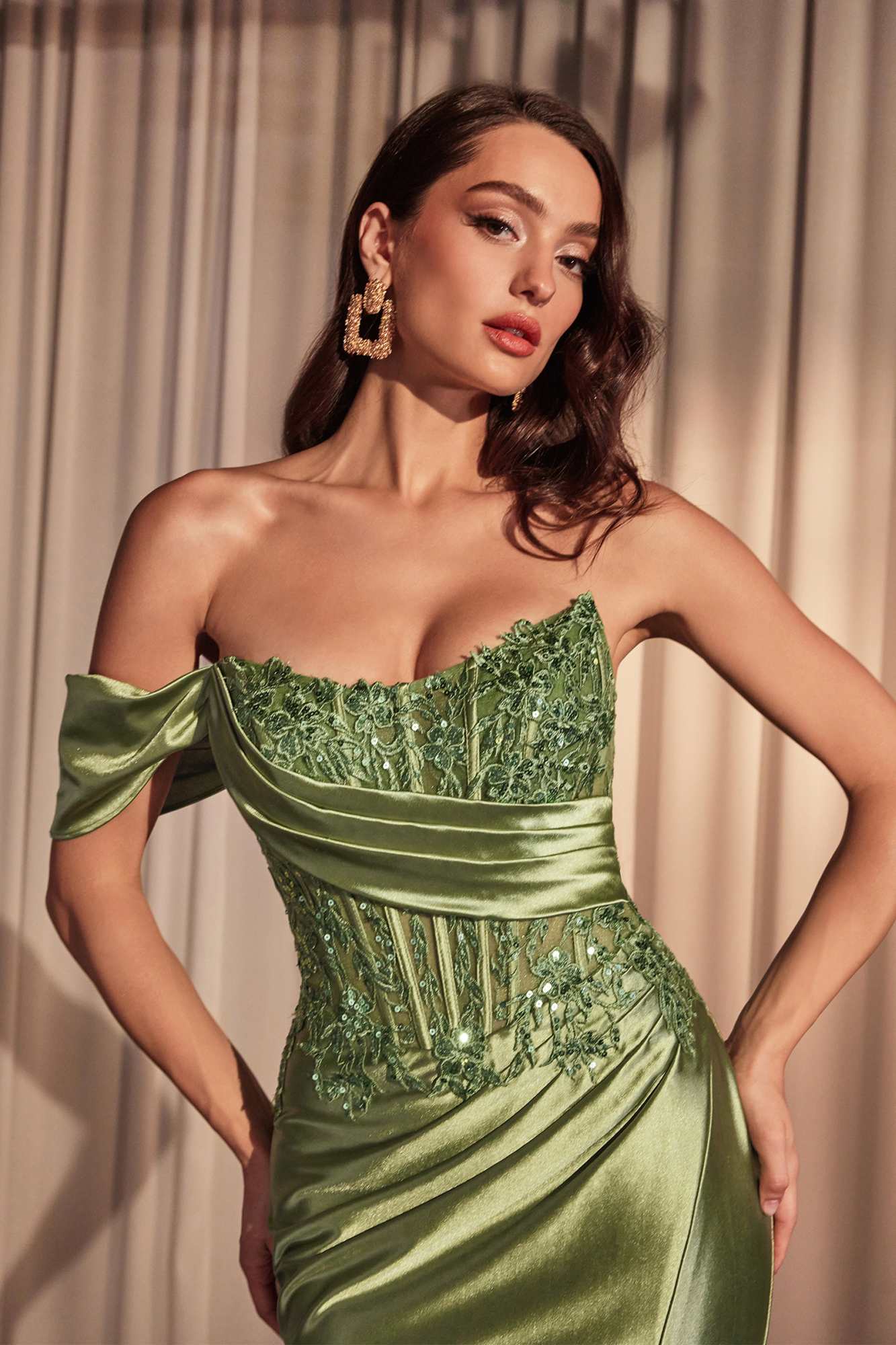 Off-shoulder prom gown in emerald green with lace bodice, draped satin off-shoulder sleeves