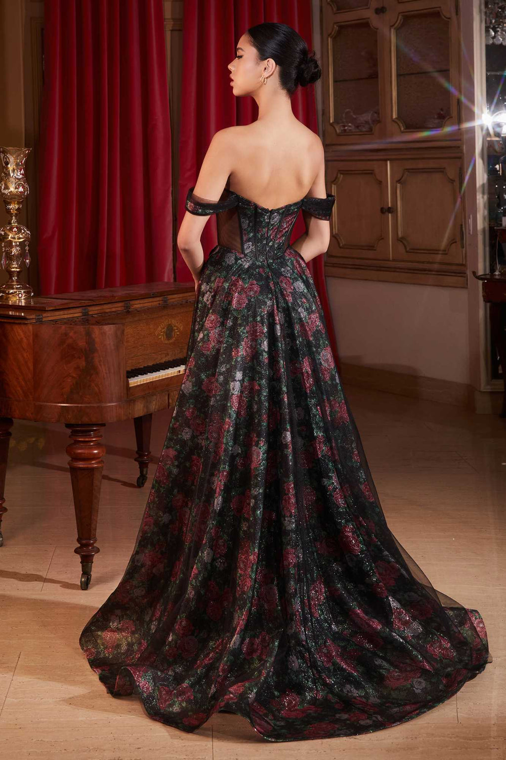 Black off-shoulder ball gown with floral underlay, open back and long full skirt