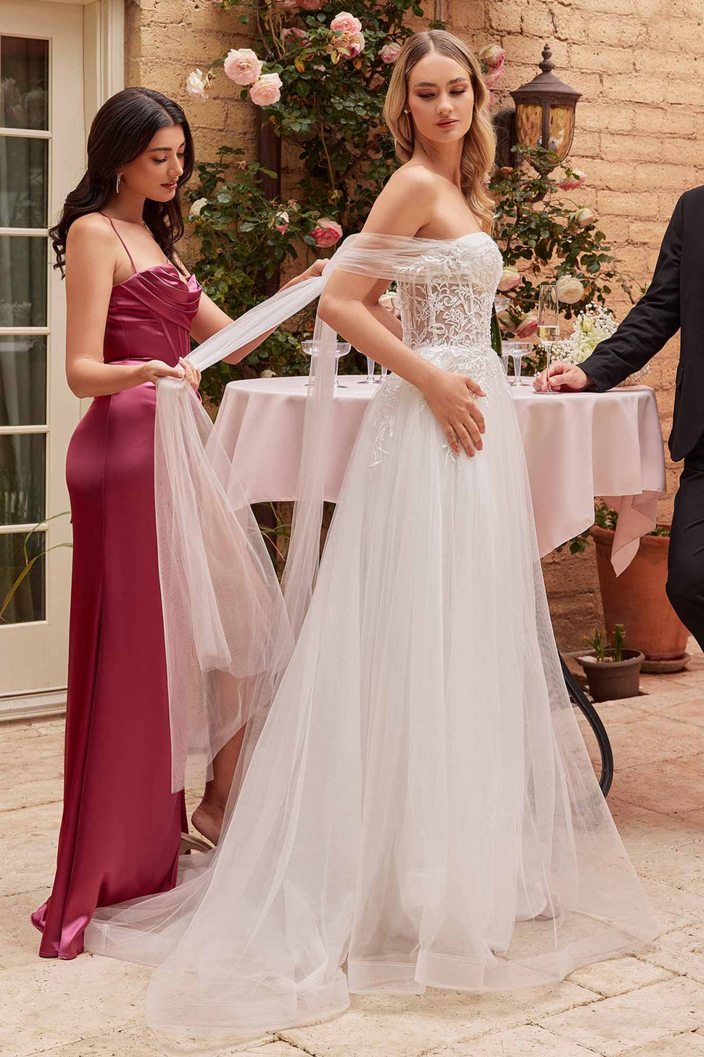 Off-white tulle A-line wedding gown with strapless lace bodice and long flowing skirt