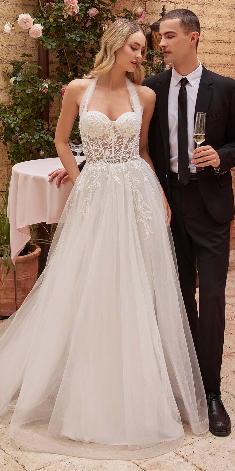 Off-white tulle A-line wedding gown with lace corset bodice and sweetheart neckline