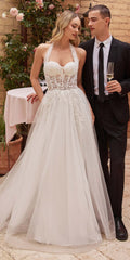 Off-white tulle A-line wedding gown with lace corset bodice and sweetheart neckline