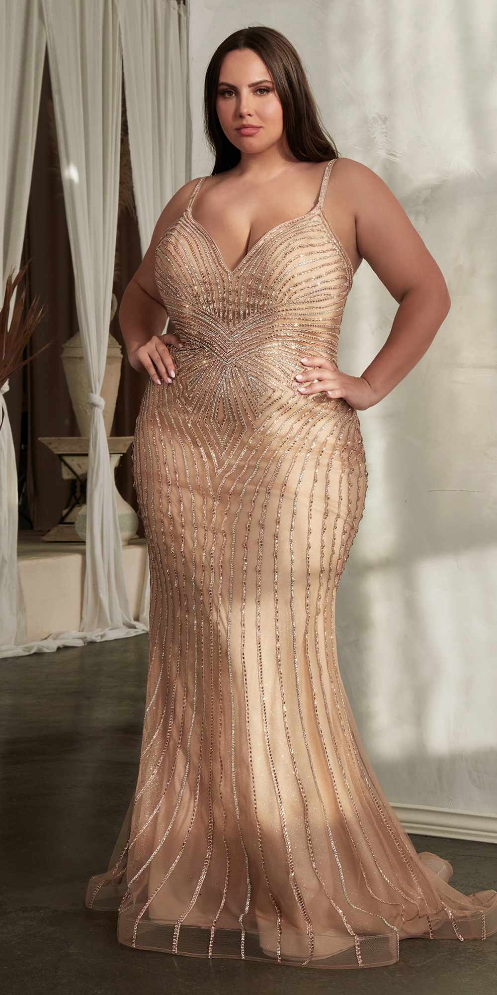 Rose gold rhinestone tulle mermaid gown with V-neck and fitted waist