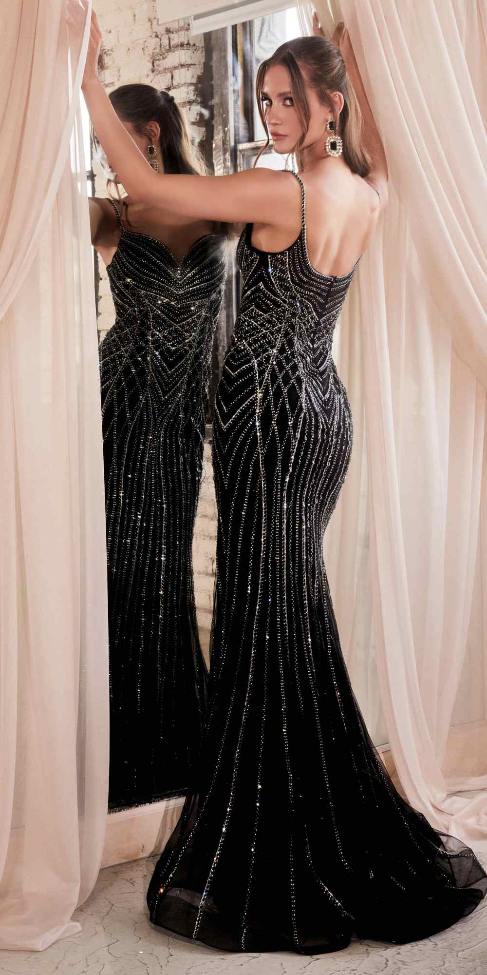 Black and silver beaded gown with deep V-back, spaghetti straps, flared skirt