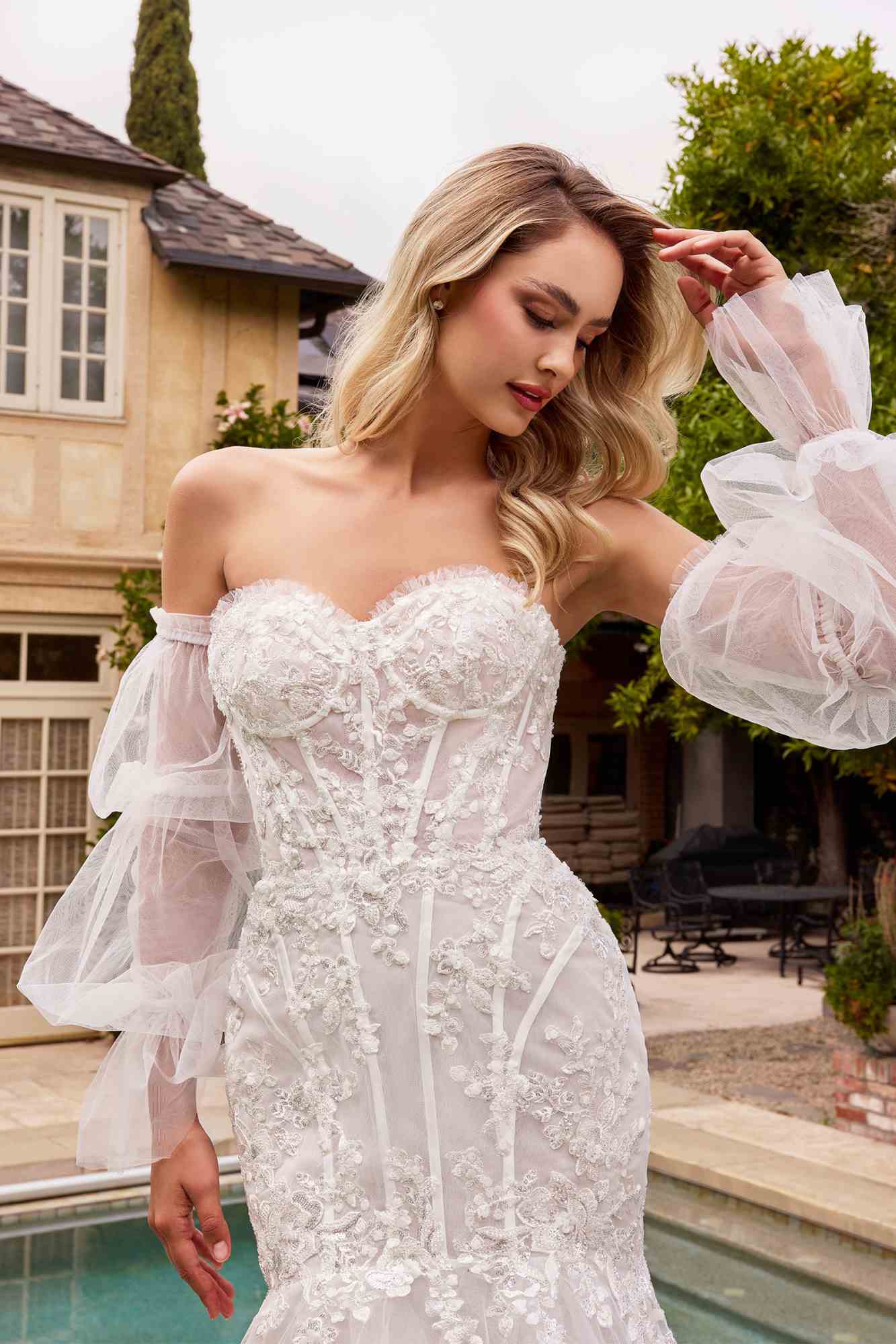Off-white strapless mermaid dress with embroidered lace bodice and sheer sleeve details