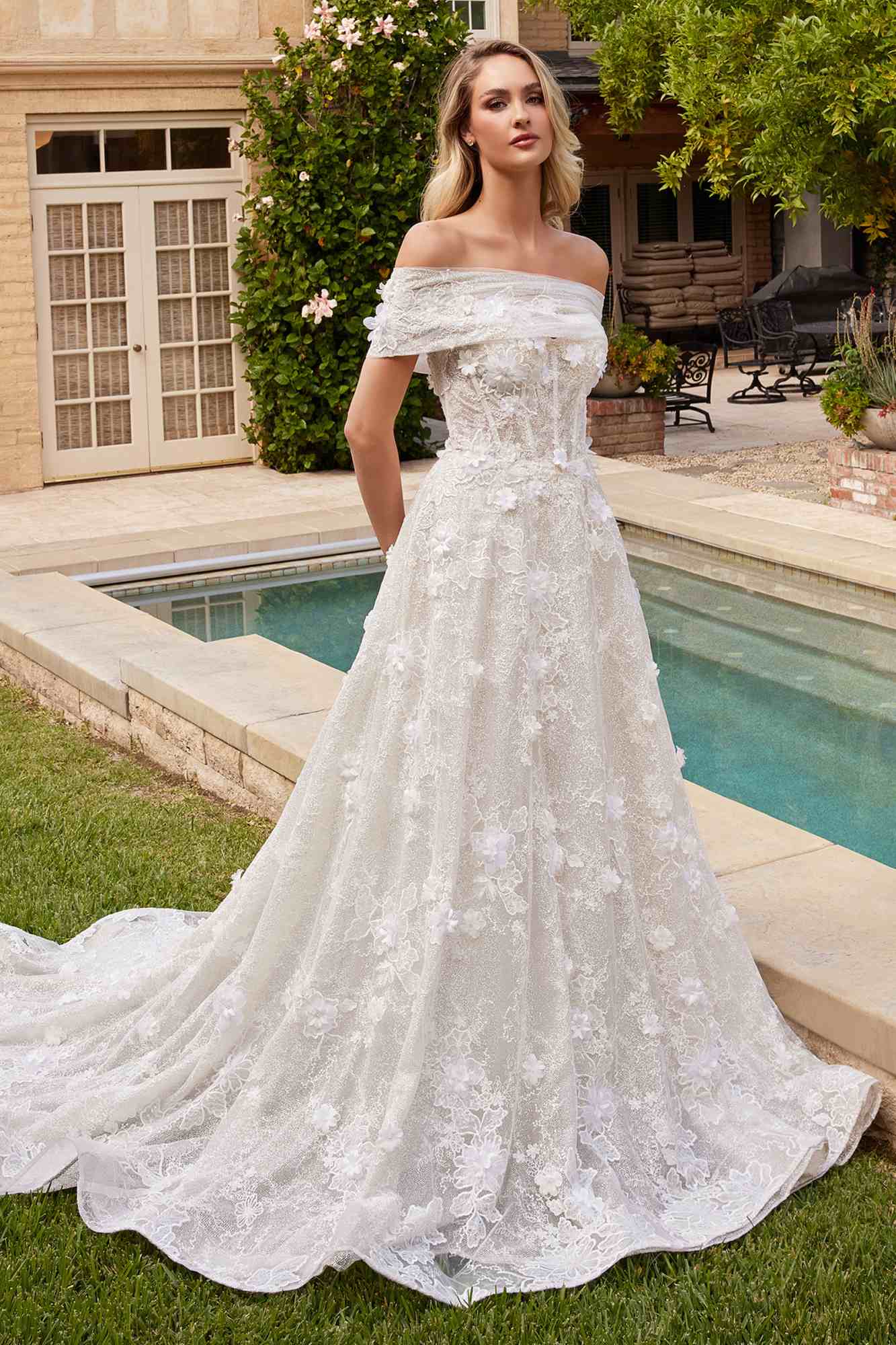 Off-white lace strapless A-line bridal gown with long chapel train and lace shawl
