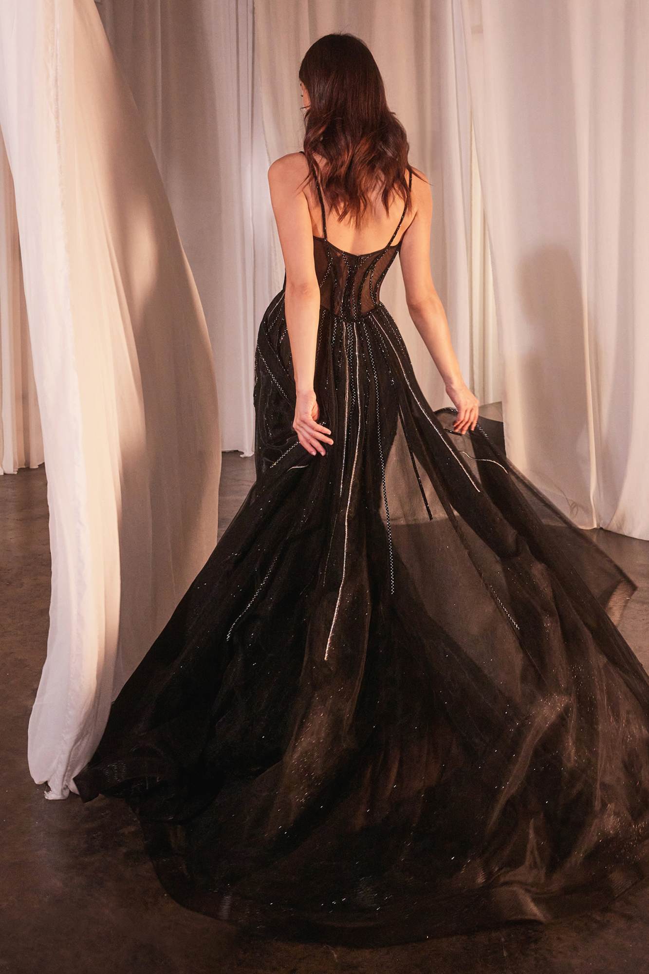 Black floor-length beaded tulle gown from back with low open back and full skirt