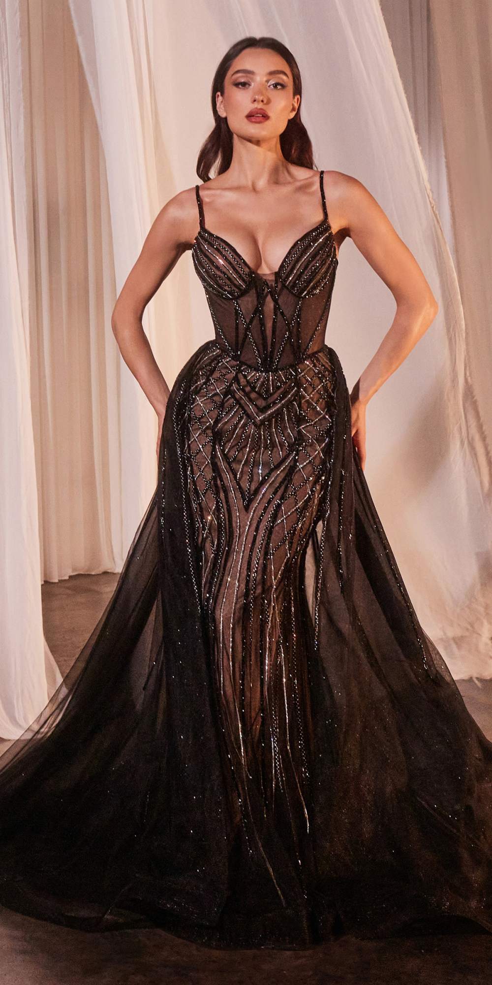 Black floor-length beaded tulle gown with corset bodice and thin spaghetti straps