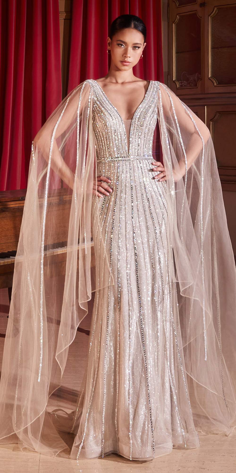 Platinum embellished formal gown with cape sleeves and long sheer tulle overlay
