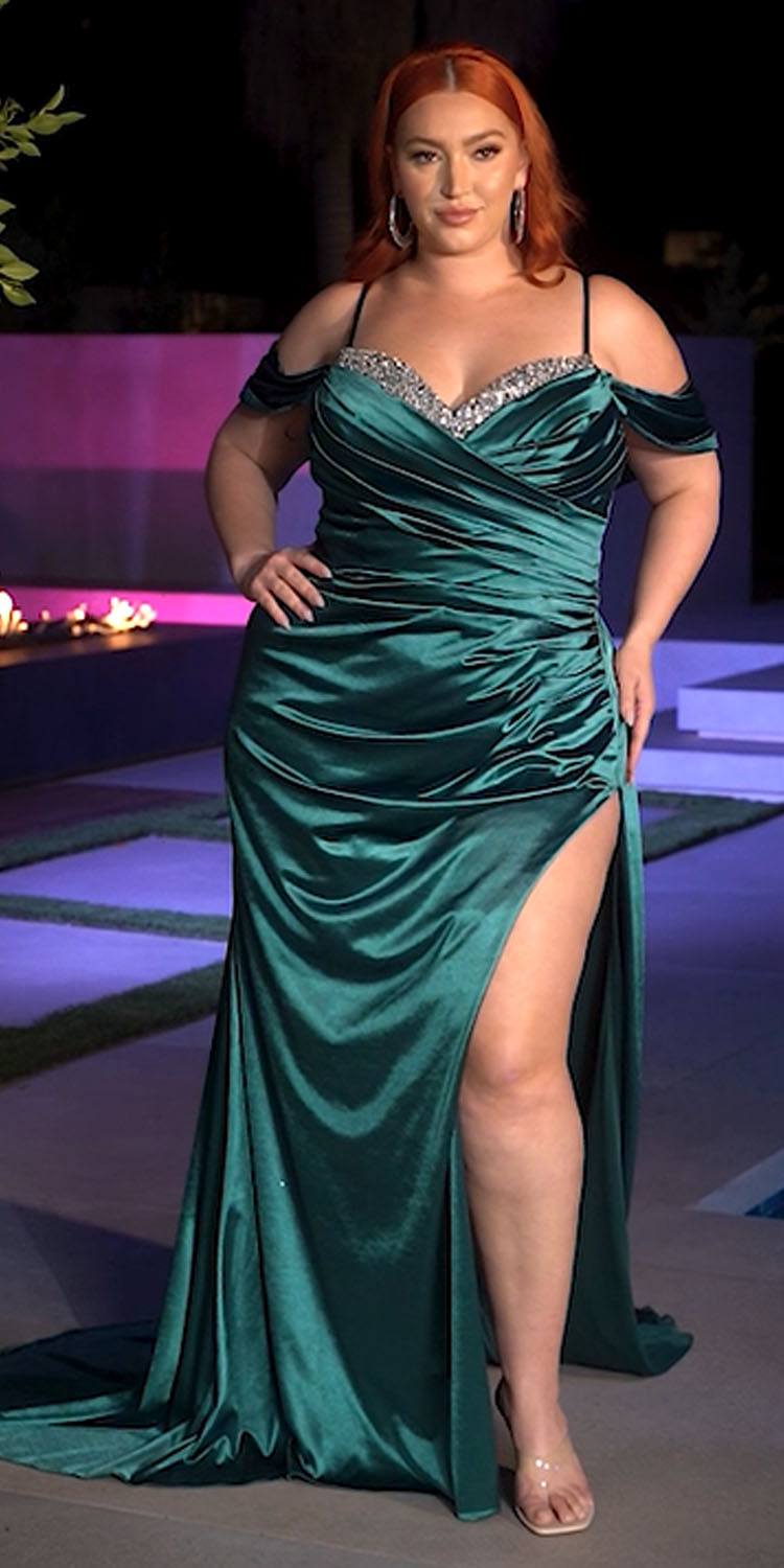 Green off-shoulder satin fitted gown with thigh slit and rhinestone neckline embellishment