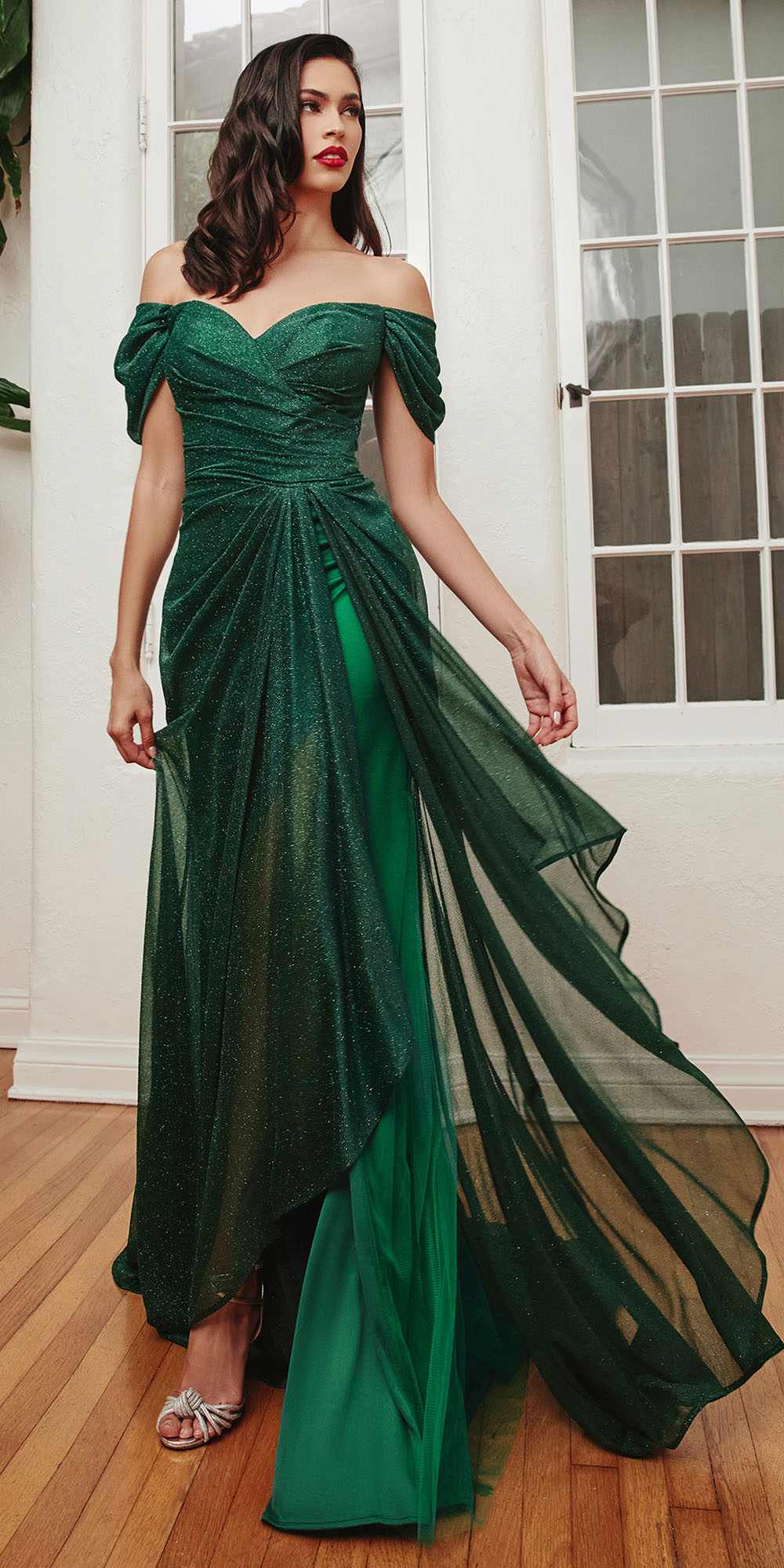 Emerald green glitter off-shoulder gown with draped waist and floor-length flowing skirt