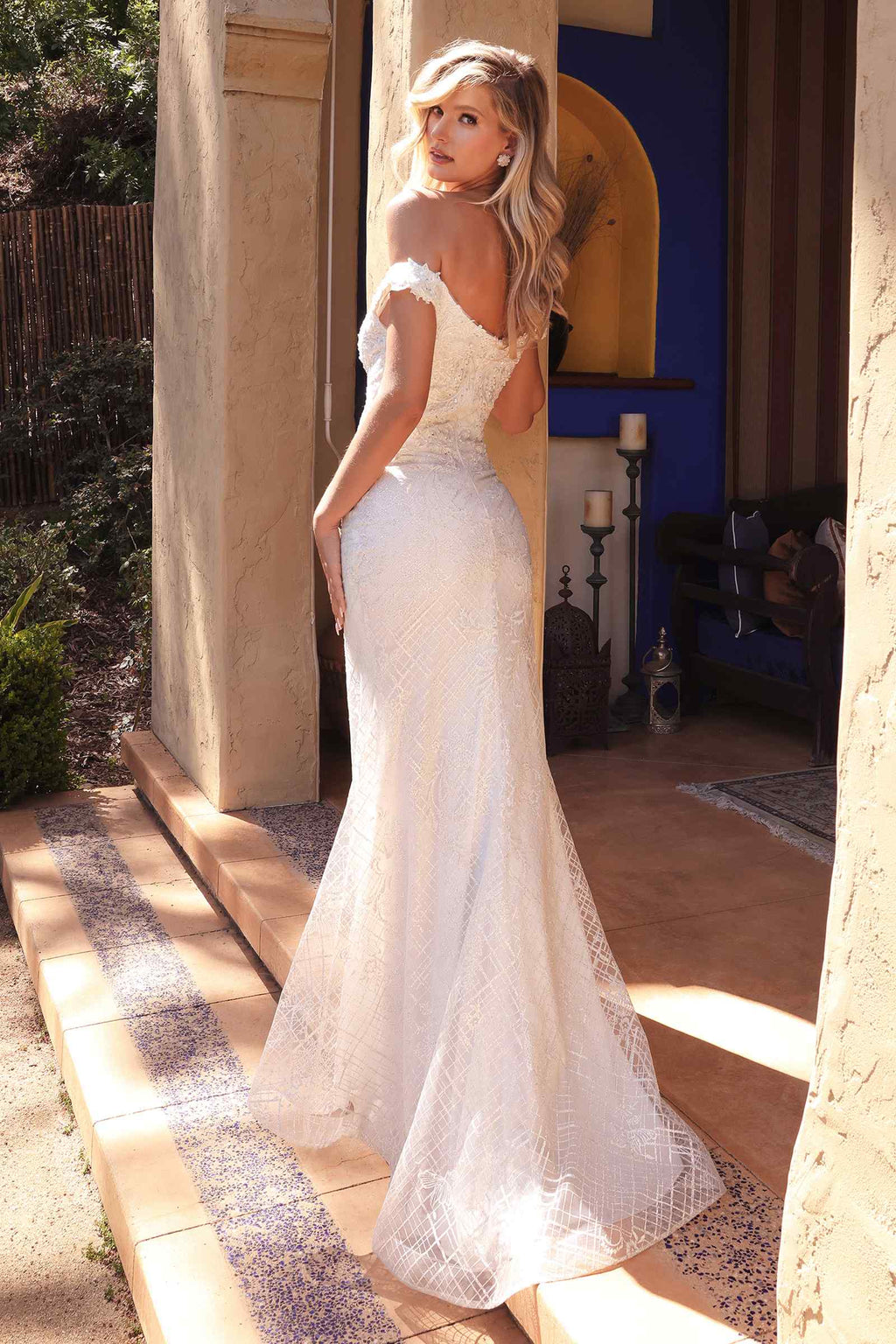 Off-white fitted off-shoulder bridal gown with lace overlay and scalloped neckline