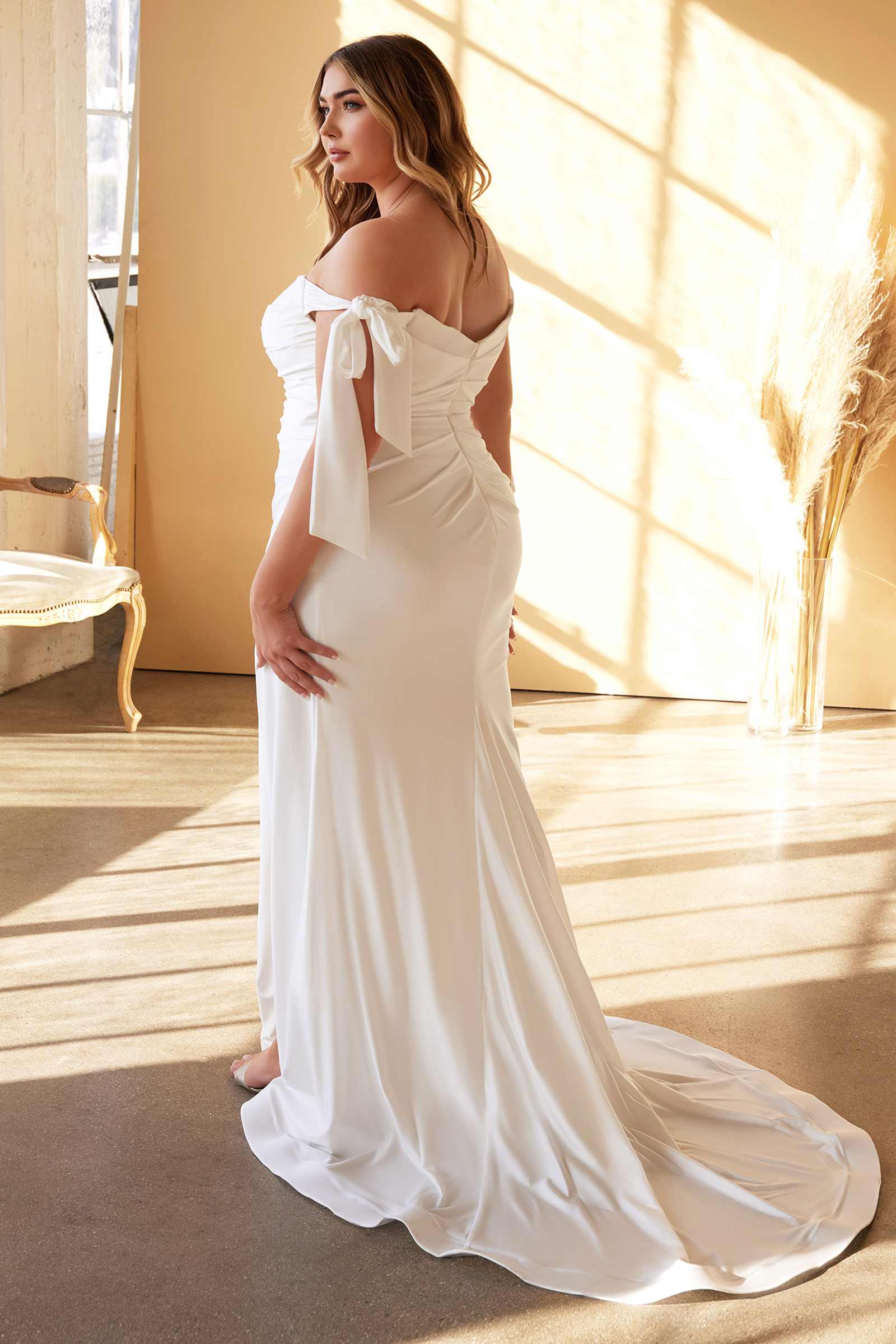 Off-the-shoulder long satin gown with tie sleeves and draped side skirt, off white