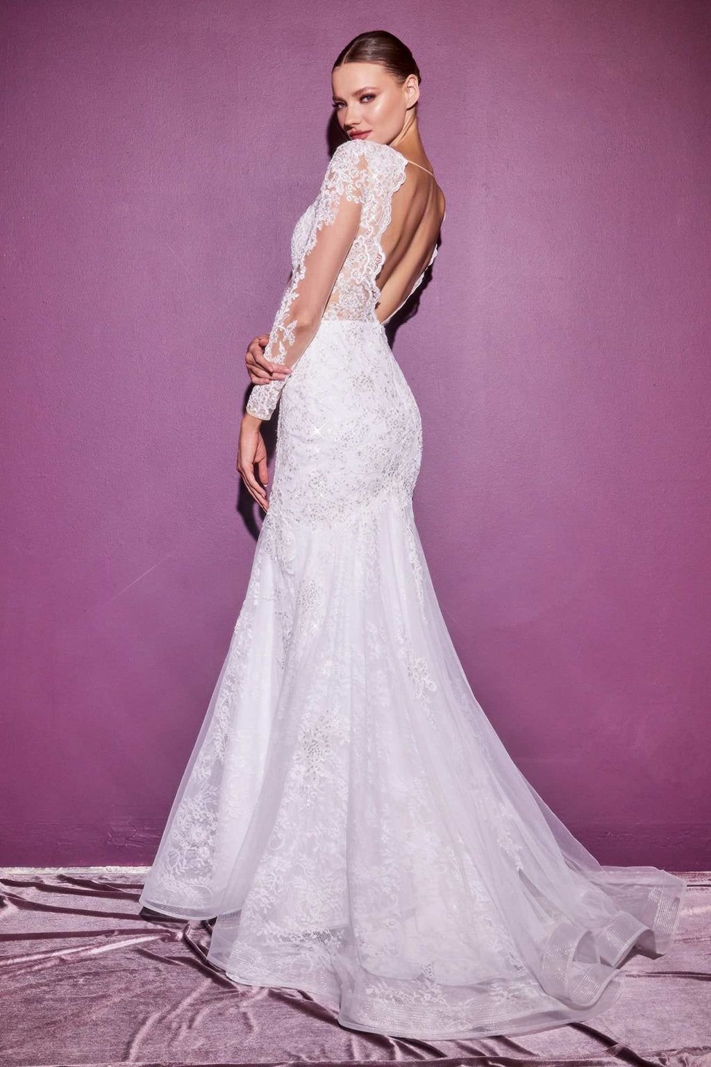 Off-white lace mermaid gown with long illusion sleeves, fitted waist, flared hem